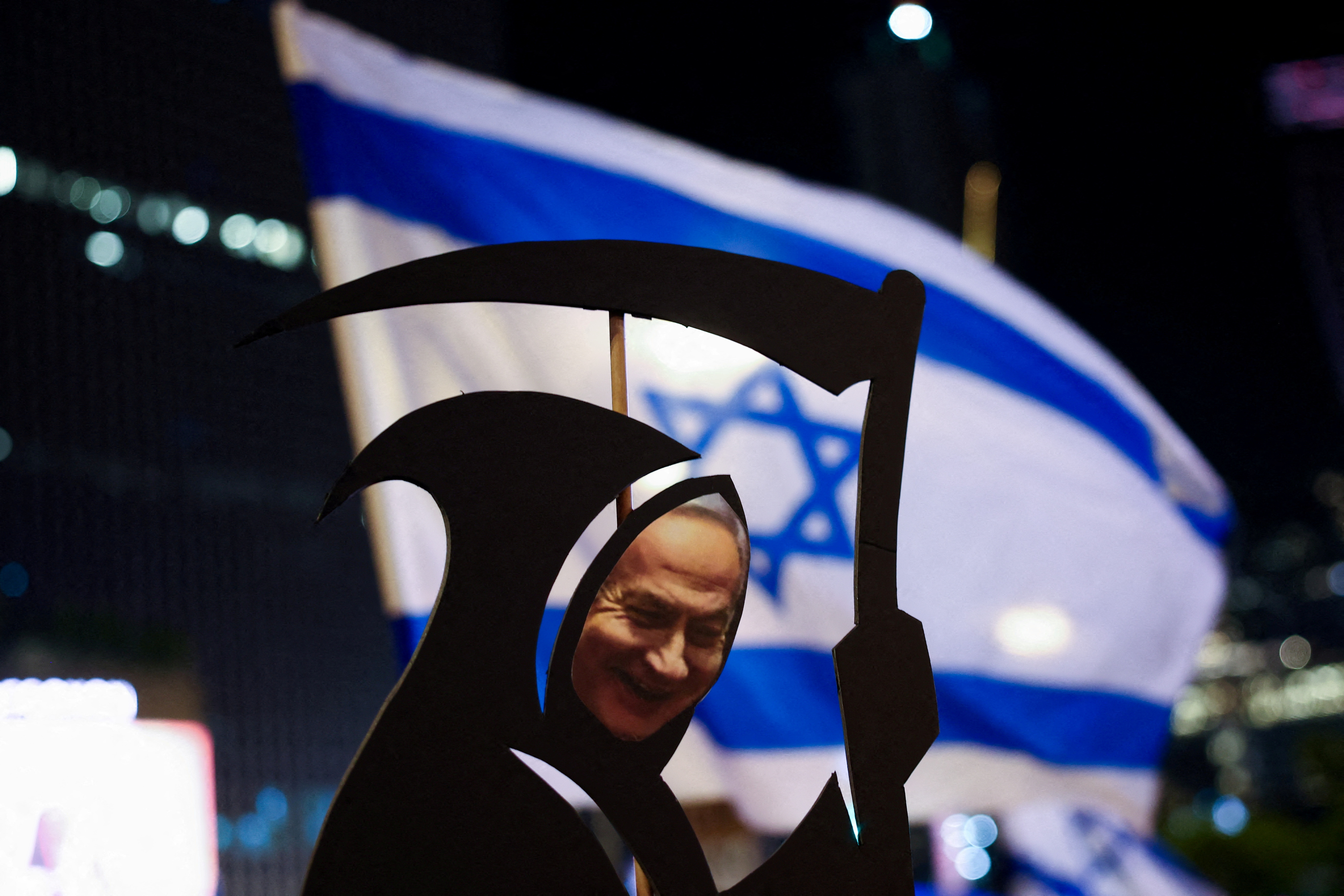 A cut-out with the image of Israeli Prime Minister Benjamin Netanyahu is seen as people demonstrate against Netanyahu's government and to call for the release of hostages in Gaza, amid the Israel-Hamas conflict, in Tel Aviv, Israel, August 31, 2024. REUTERS/Florion Goga TPX IMAGES OF THE DAY