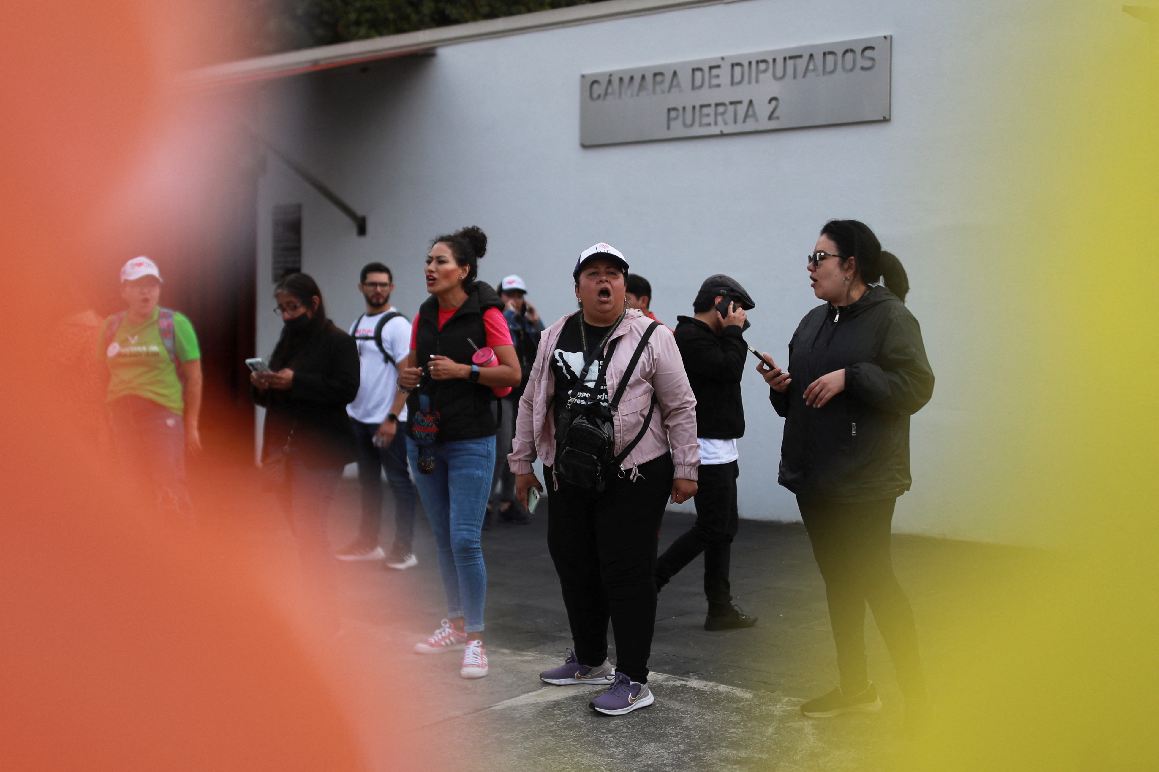 Protesters form a line outside the Chamber of Deputies in Mexico City.