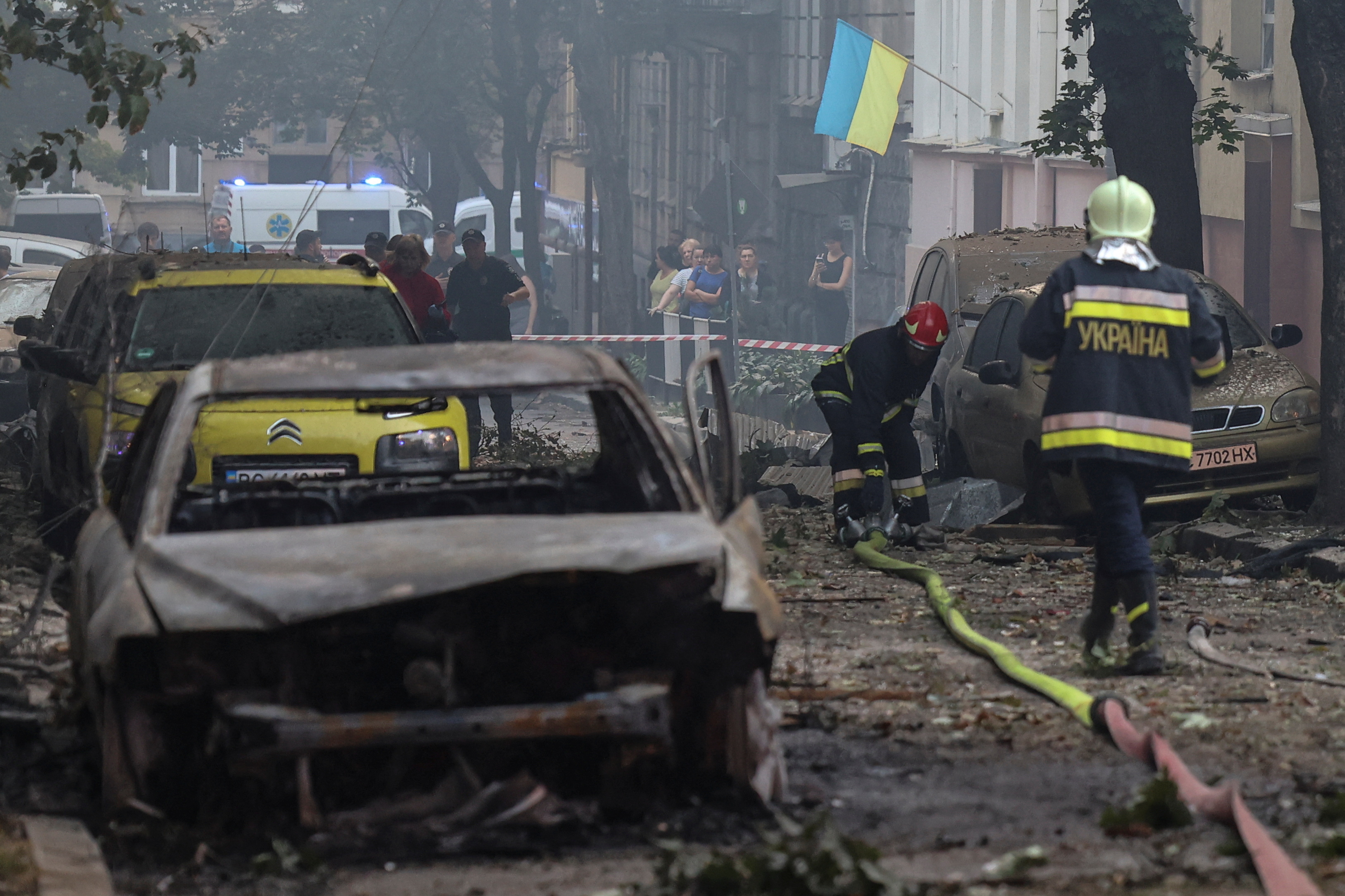 Rescuers work at the site of a residential building damaged during a Russian strike