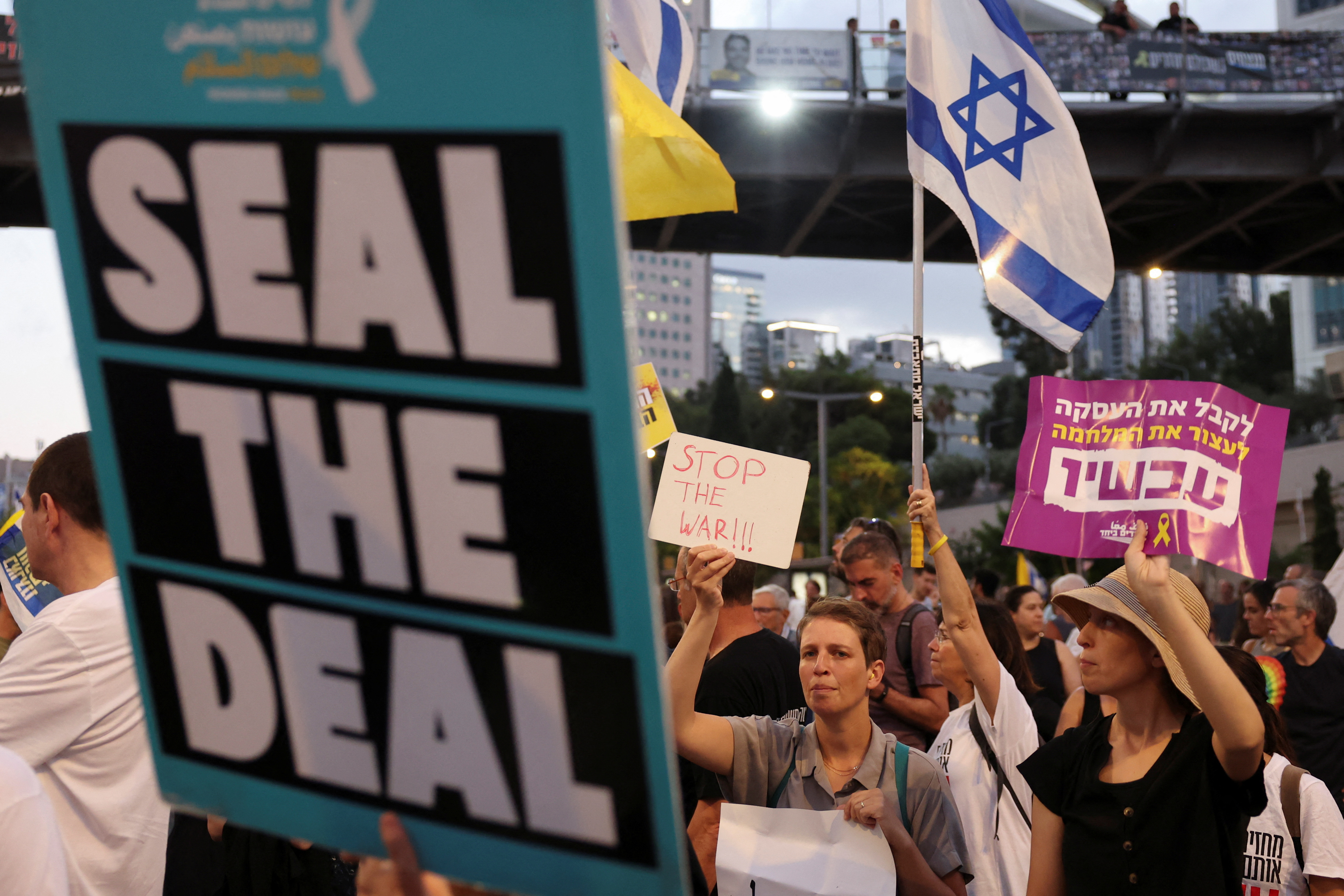 Demonstrators call for a ceasefire in Gaza to secure the release of captives being held there.