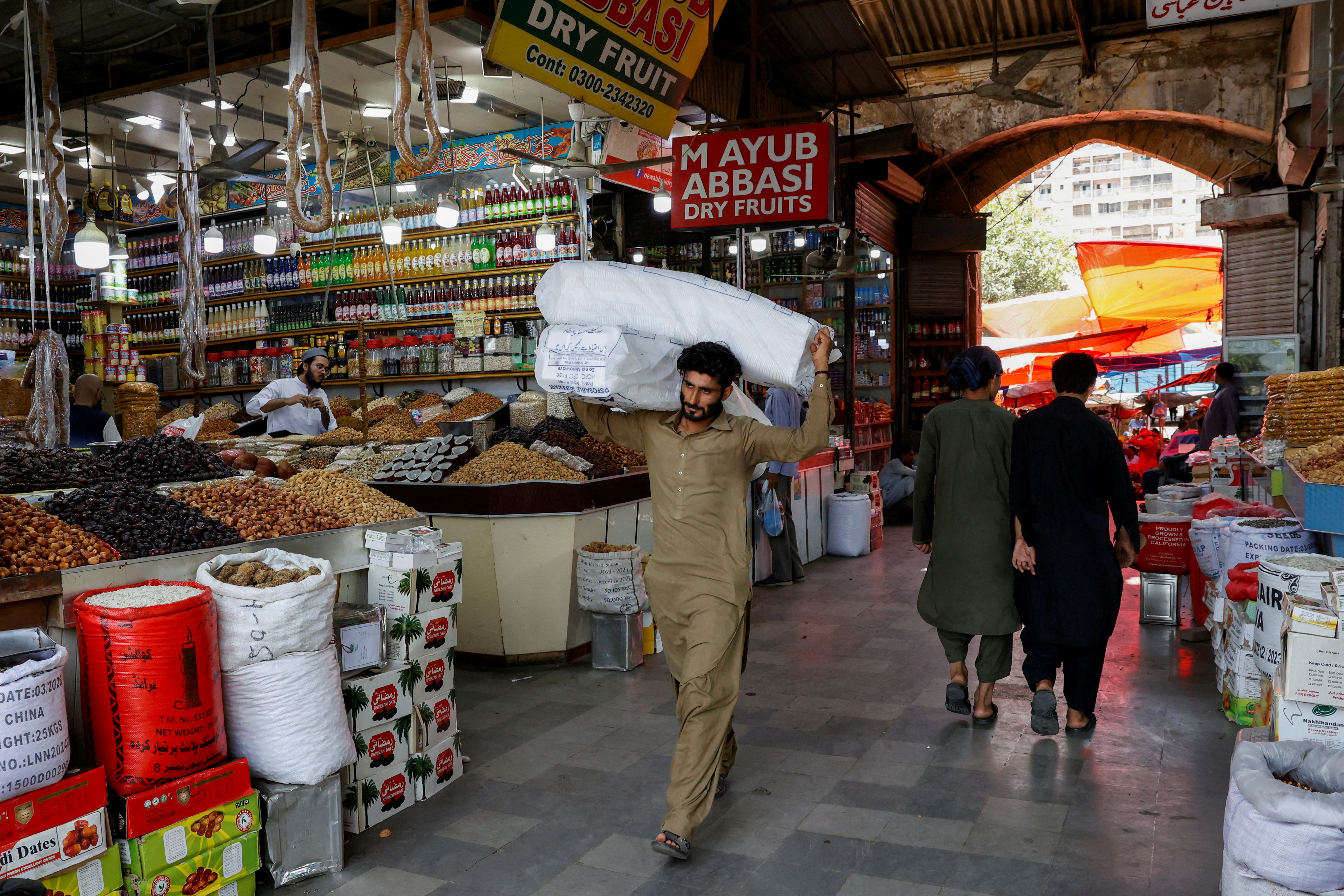 Pakistan has secured a 37-month-long, $7bn loan from the IMF but analysts say the government must take steps to protect the poor [Akhtar Soomro/Reuters]