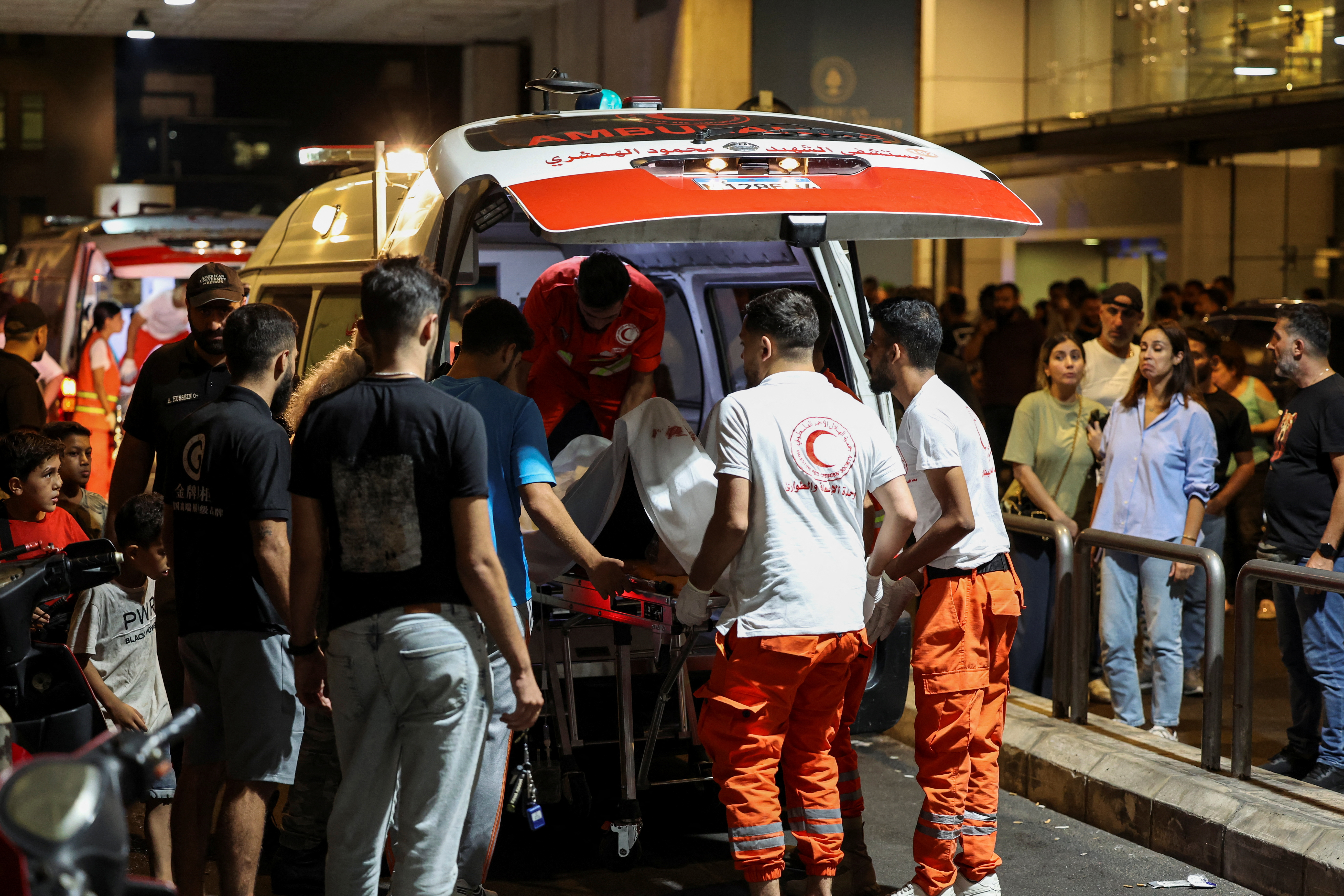 A person is carried on a stretcher outside American University of Beirut Medical Center after people were wounded and killed by Israel's exploding pager attack in Beirut, Lebanon September 17, 2024. [Mohamed Azakir/Reuters]