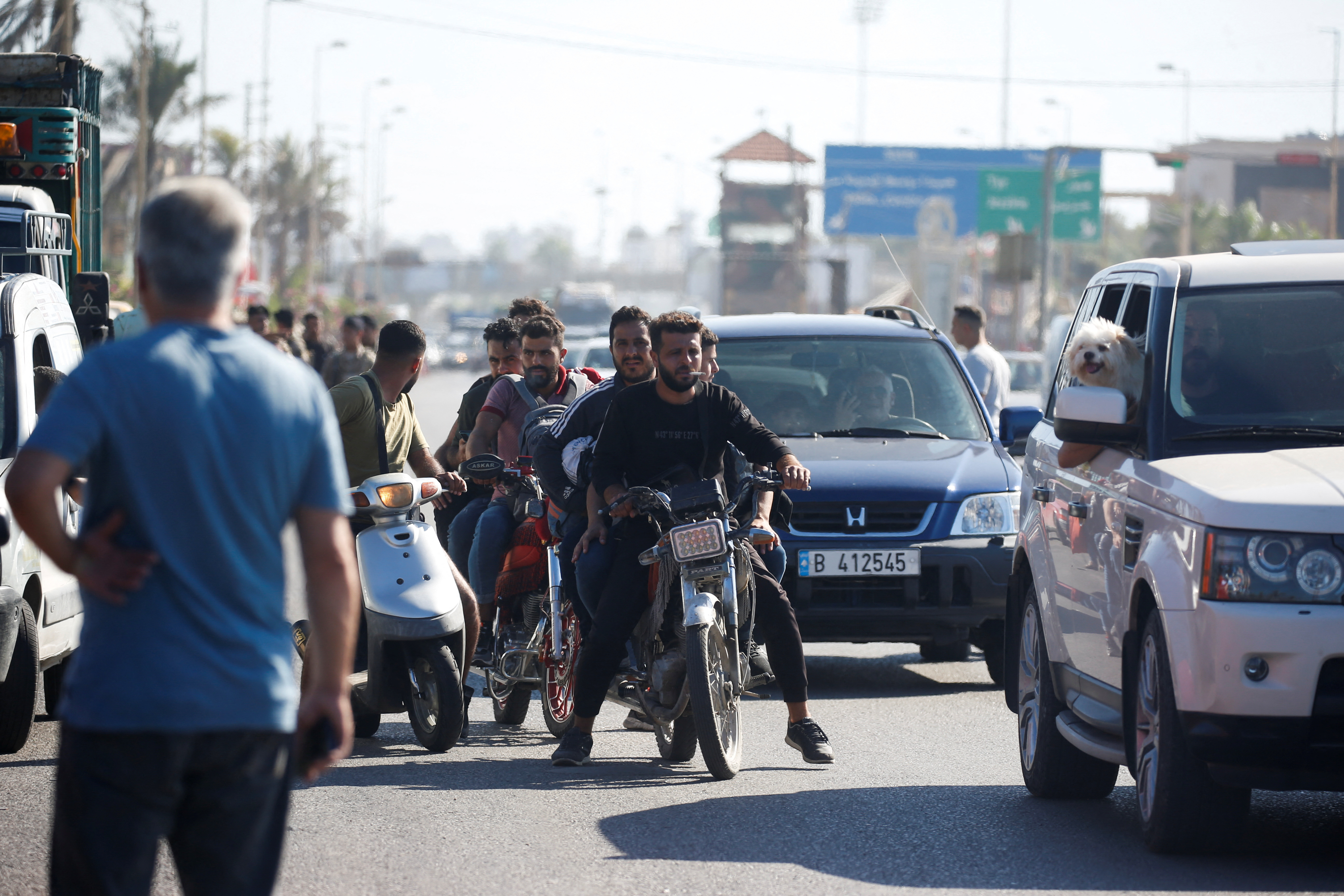 People in heavy traffic drive north from Lebanon's southern coastal city Sidon as some of them flee Israeli bombardment