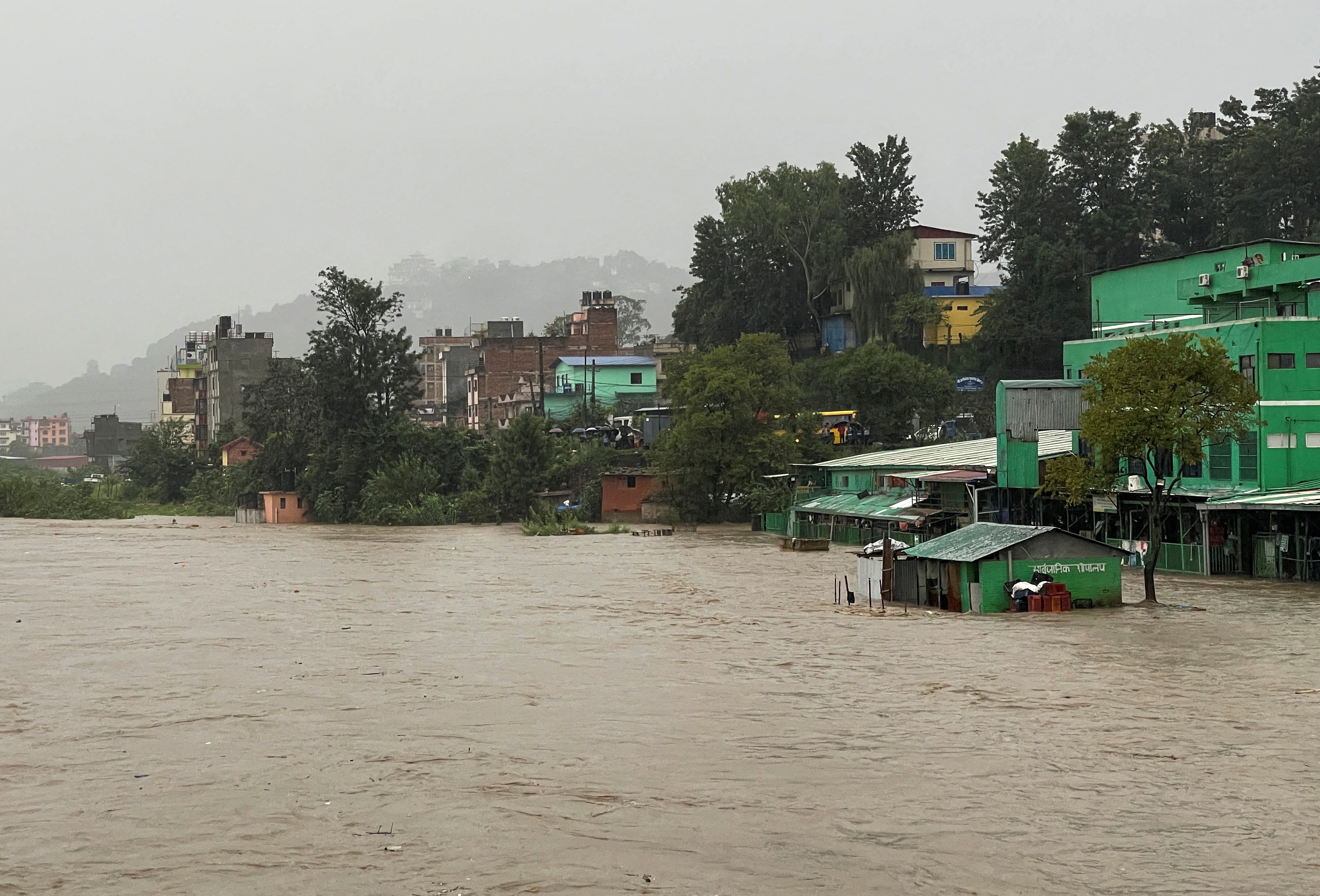 A general view of the overflowing Bagmati River following heavy rains, in Kathmandu, Nepal September 27, 2024. REUTERS/Navesh Chitrakar REFILE - CORRECTING YEAR FROM "SEPTEMBER 27, 2023" TO "SEPTEMBER 27, 2024