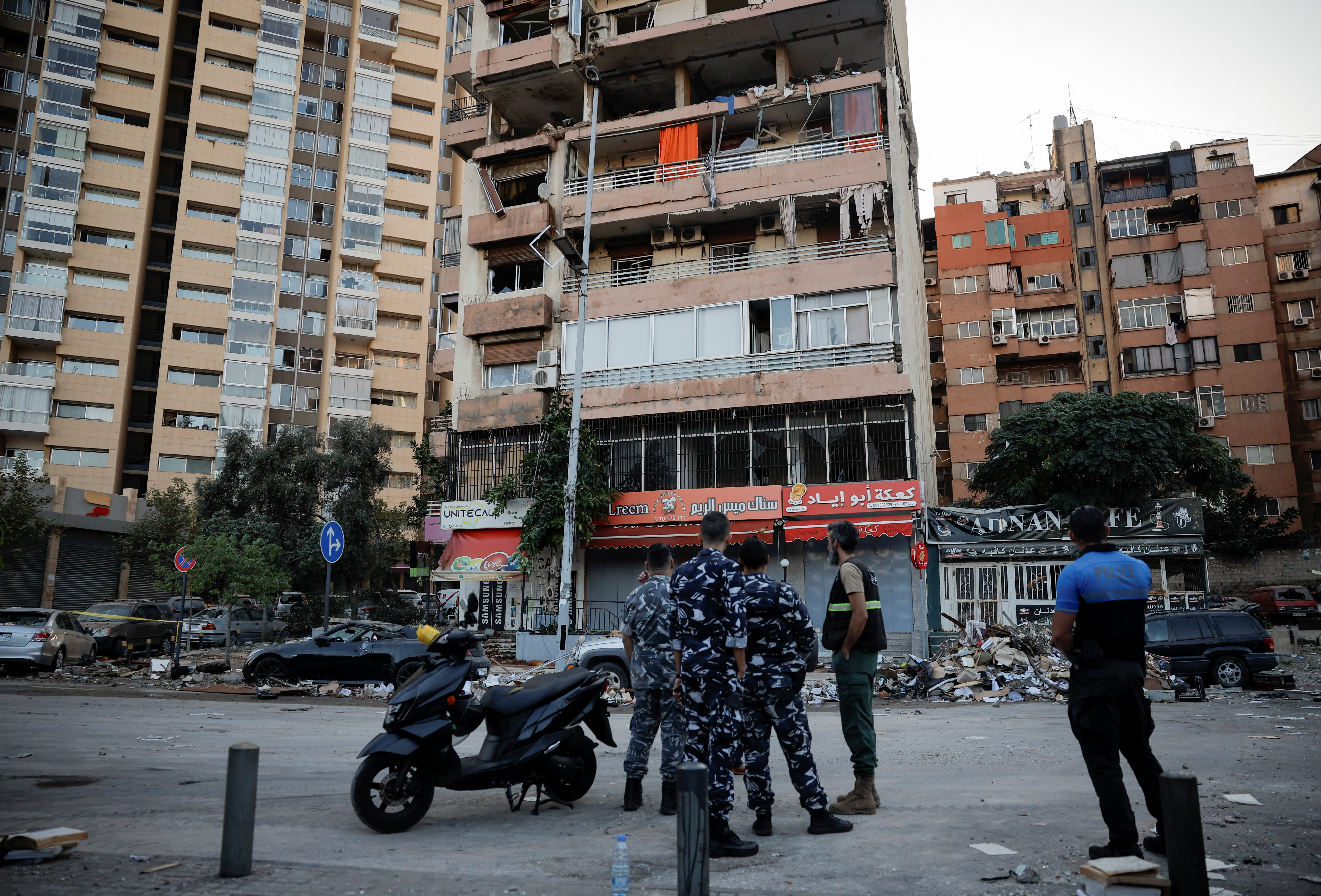 Police officers work at the site of an Israeli strike, amid ongoing cross-border hostilities between Hezbollah and Israeli forces, in Kola, central Beirut, Lebanon, September 30, 2024. REUTERS/Louisa Gouliamaki