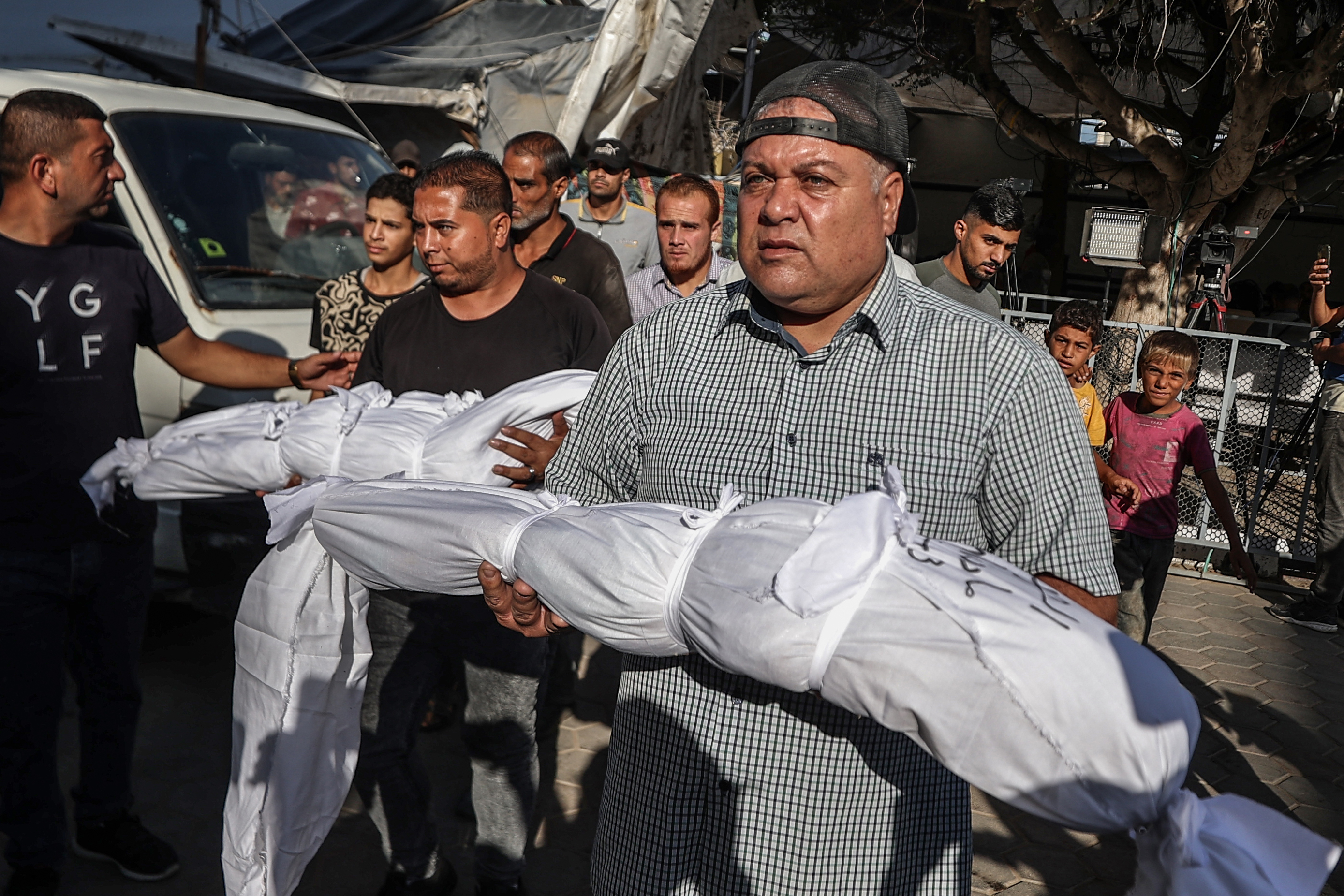 Relatives carry bodies of Palestinians,