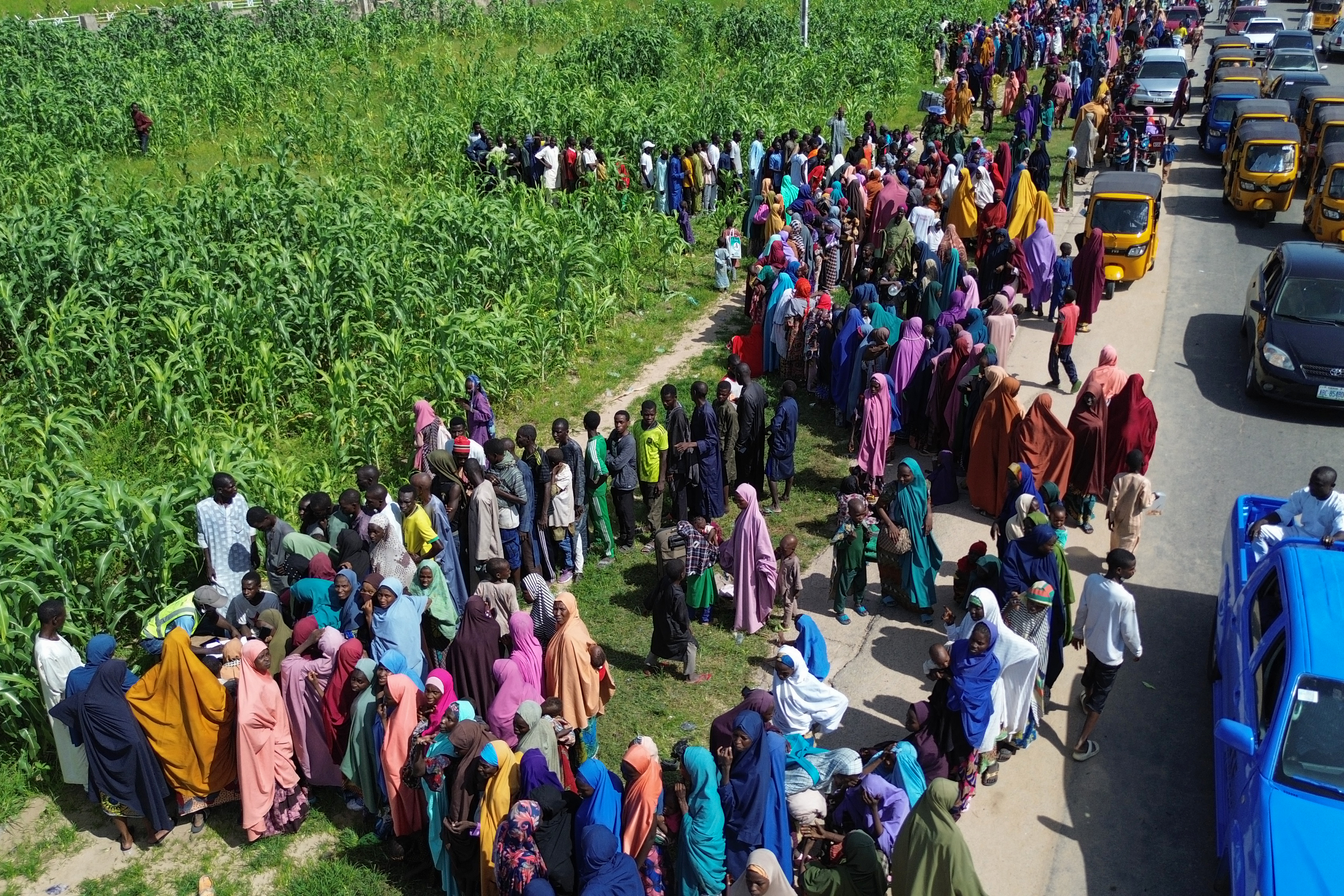 People queue to register for aid