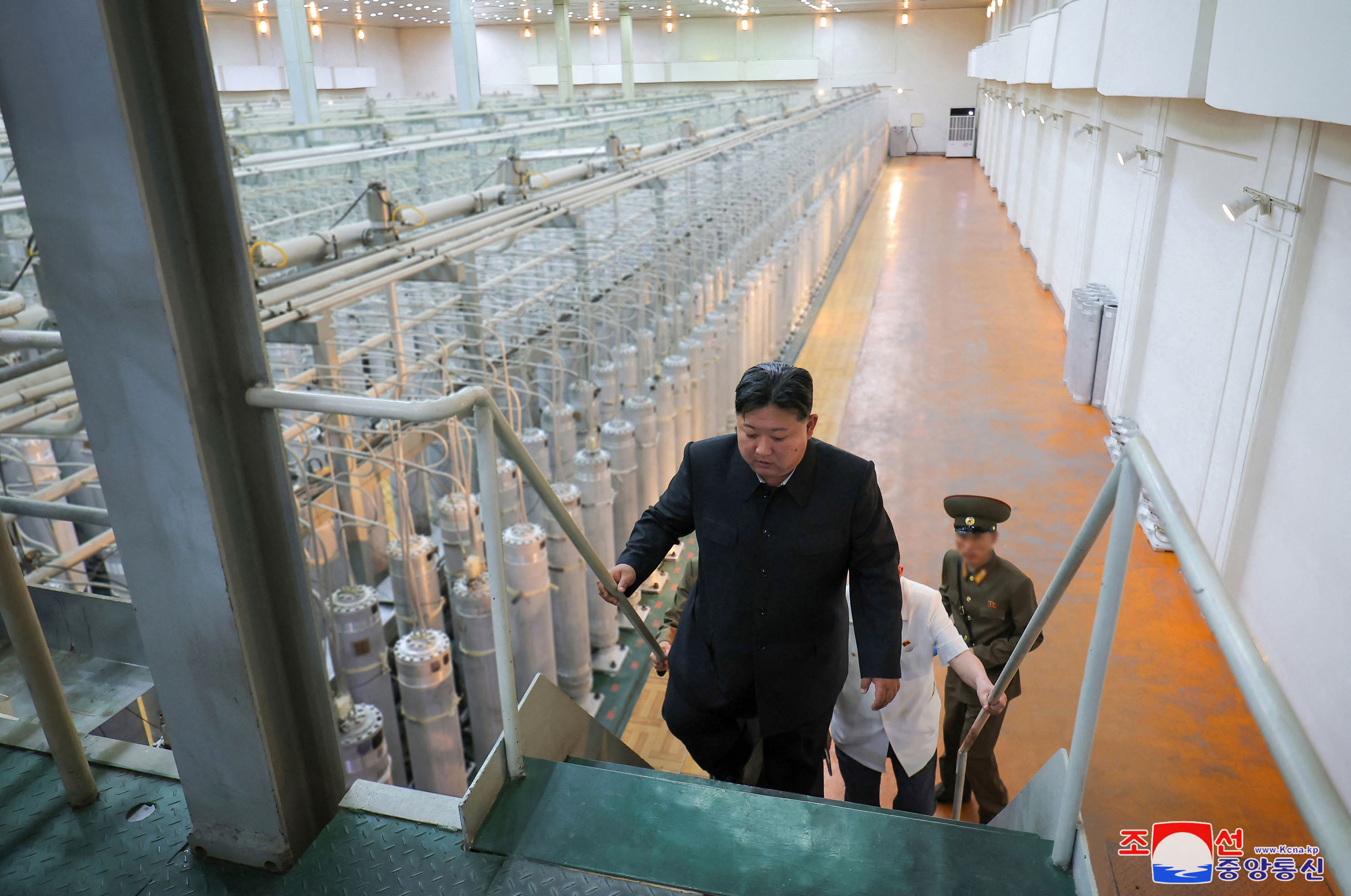 This undated photo released from North Korea's official Korean Central News Agency (KCNA) via KNS on September 13, 2024 shows North Korean leader Kim Jong Un (front) inspecting the Nuclear Weapons Institute and the production base of weapon-grade nuclear materials, at an undisclosed location in North Korea. (Photo by KCNA VIA KNS / AFP) / SOUTH KOREA OUT / ---EDITORS NOTE--- RESTRICTED TO EDITORIAL USE - MANDATORY CREDIT "AFP PHOTO/KCNA VIA KNS" - NO MARKETING NO ADVERTISING CAMPAIGNS - DISTRIBUTED AS A SERVICE TO CLIENTS THIS PICTURE WAS MADE AVAILABLE BY A THIRD PARTY. AFP CAN NOT INDEPENDENTLY VERIFY THE AUTHENTICITY, LOCATION, DATE AND CONTENT OF THIS IMAGE. SOUTH KOREA OUT / ---EDITO