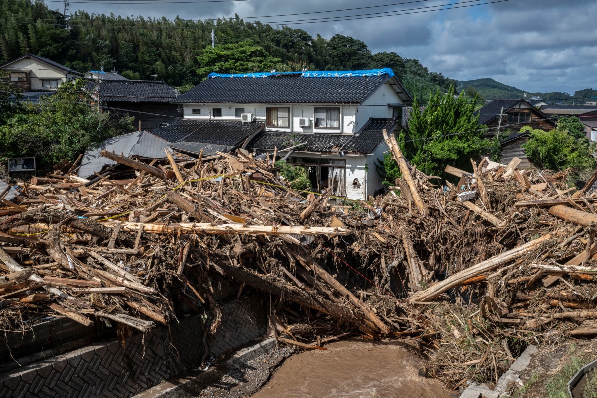 Rescuers comb muddy riverbanks after Japan floods kill six