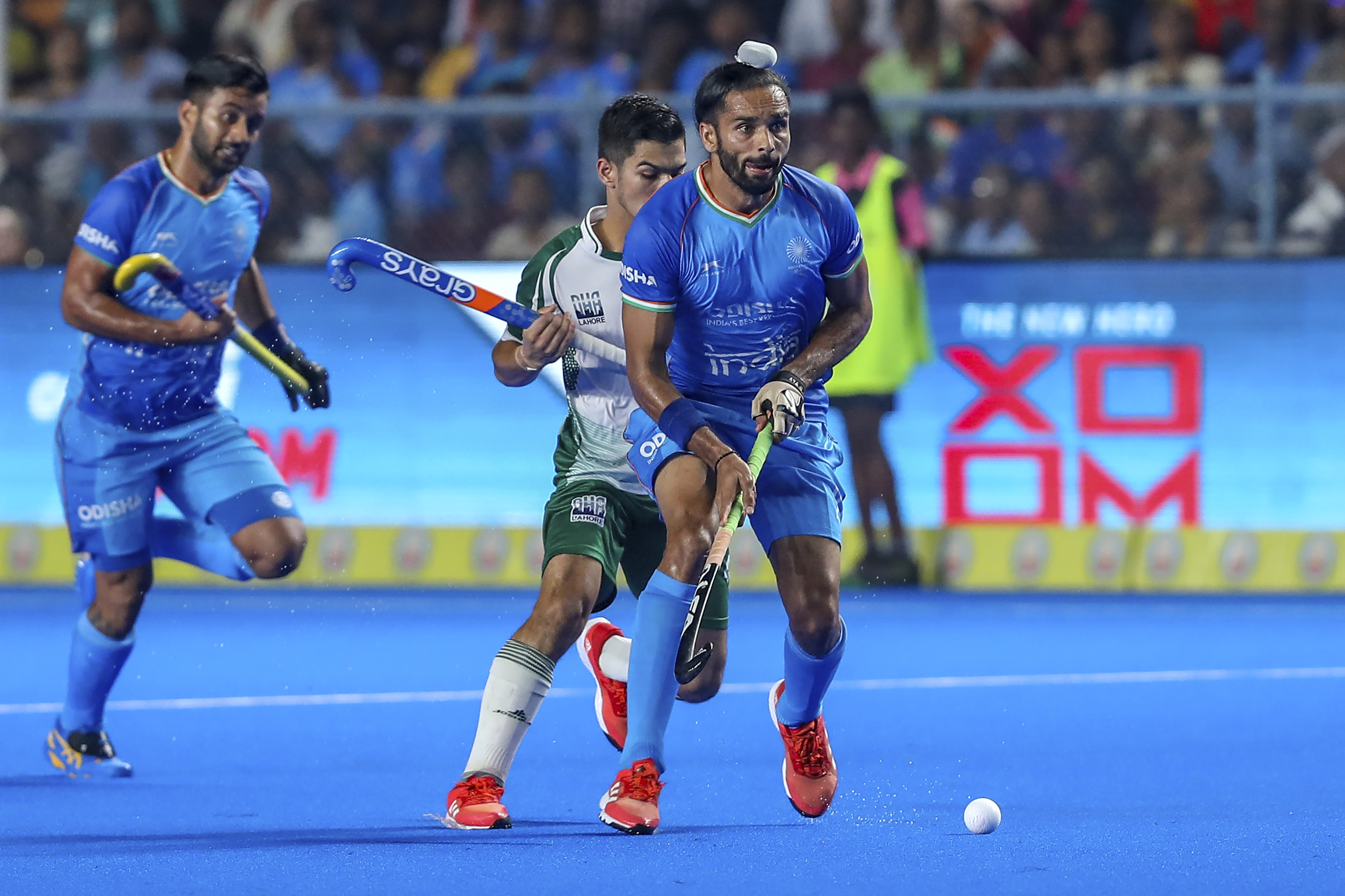 India's Akashdeep Singh, right, takes control of the ball during the men's Asian Champions Trophy hockey match between India and Pakistan in Chennai, India, Wednesday, Aug. 9, 2023. (AP Photo/R. Parthibhan)