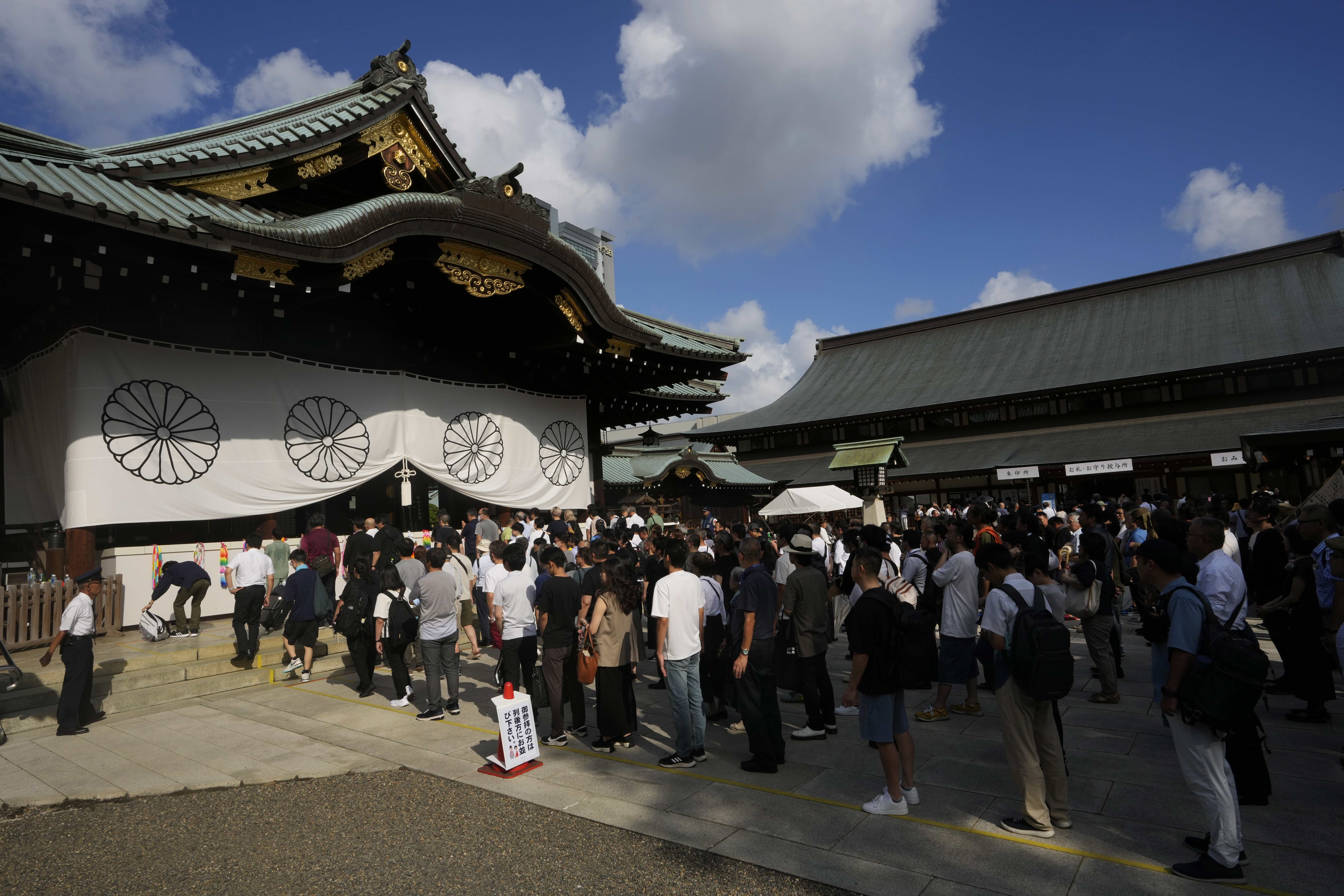 People queue to get into the Yasukuni shrine in August