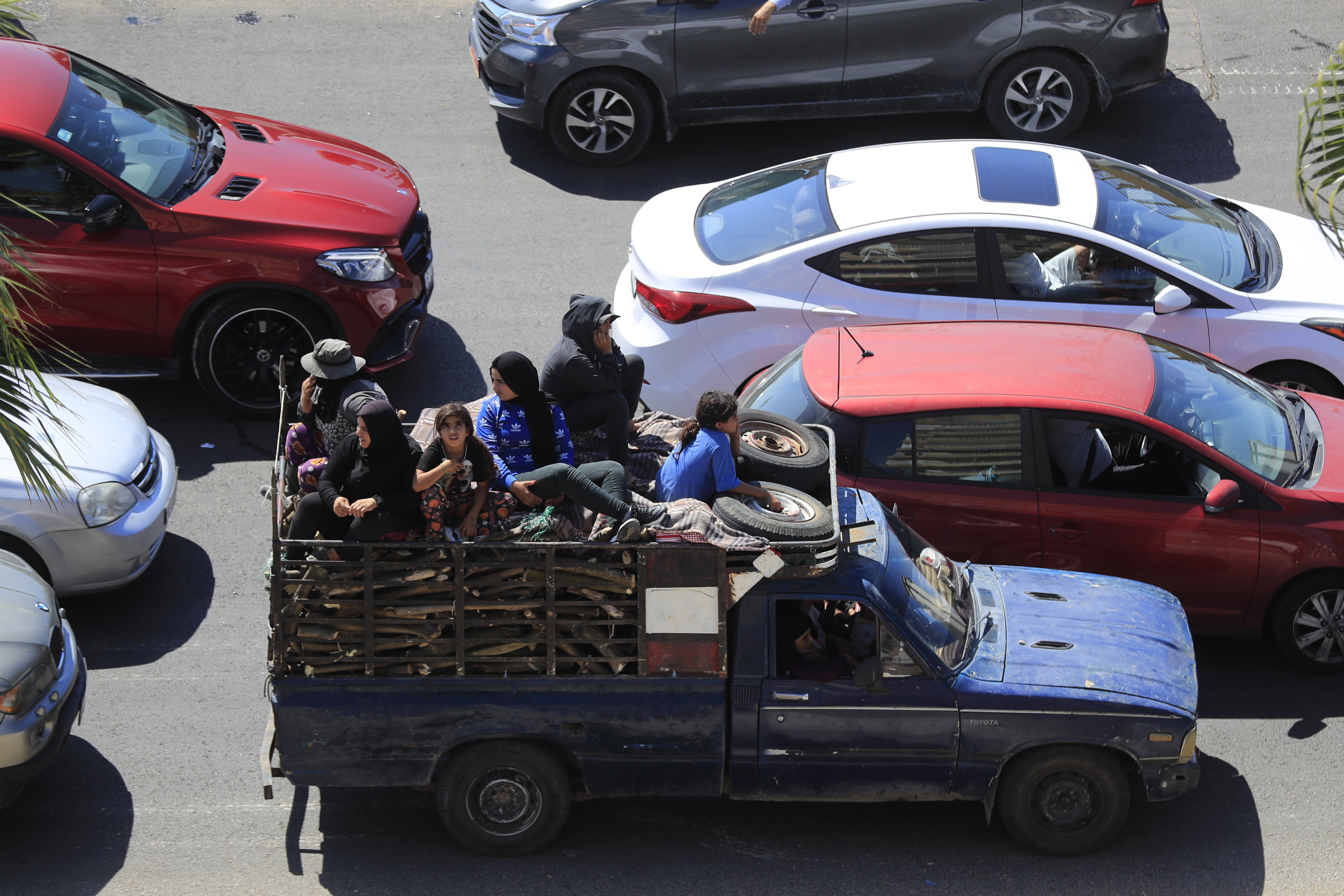 Cars sit in traffic as people flee the southern villages amid ongoing Israeli airstrikes