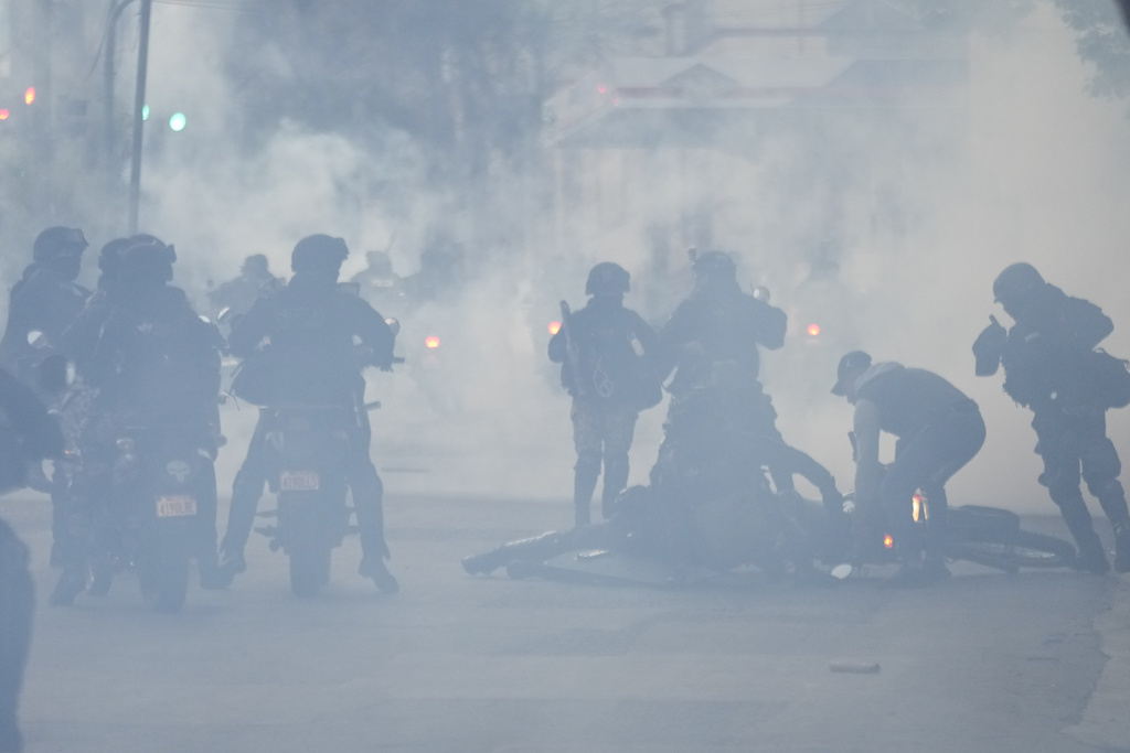 Police throw gas at protesters who clashed with supporters of President Luis Arce in La Paz, Bolivia, Monday, September 23, 2024. [AP Photo/Juan Karita]