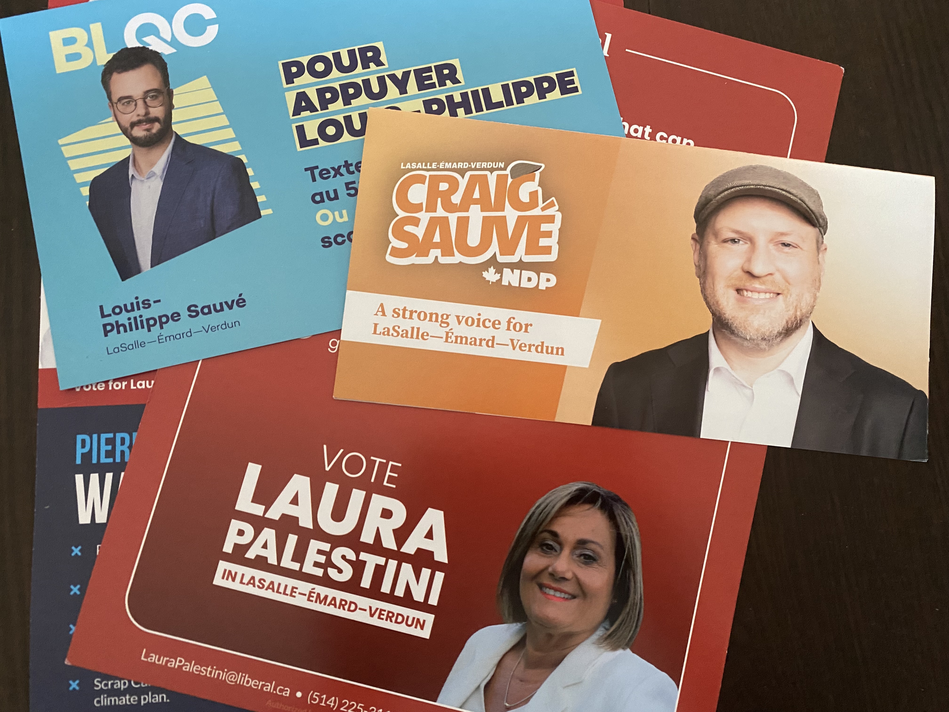 Campaign pamphlets for the leading candidates in a Montreal byelection