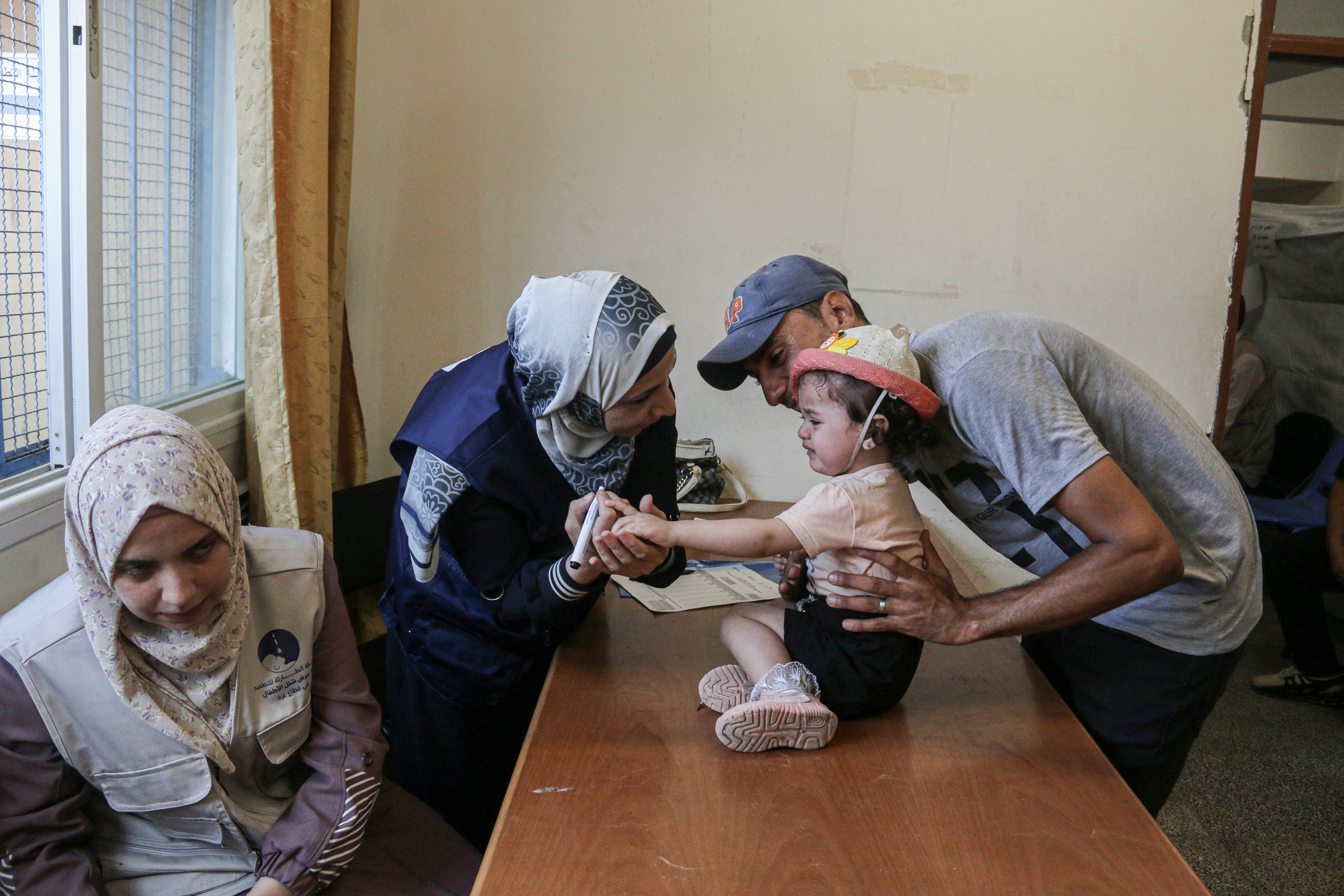 Polio in Gaza [Abdelhakim Abu Riash/Al Jazeera]