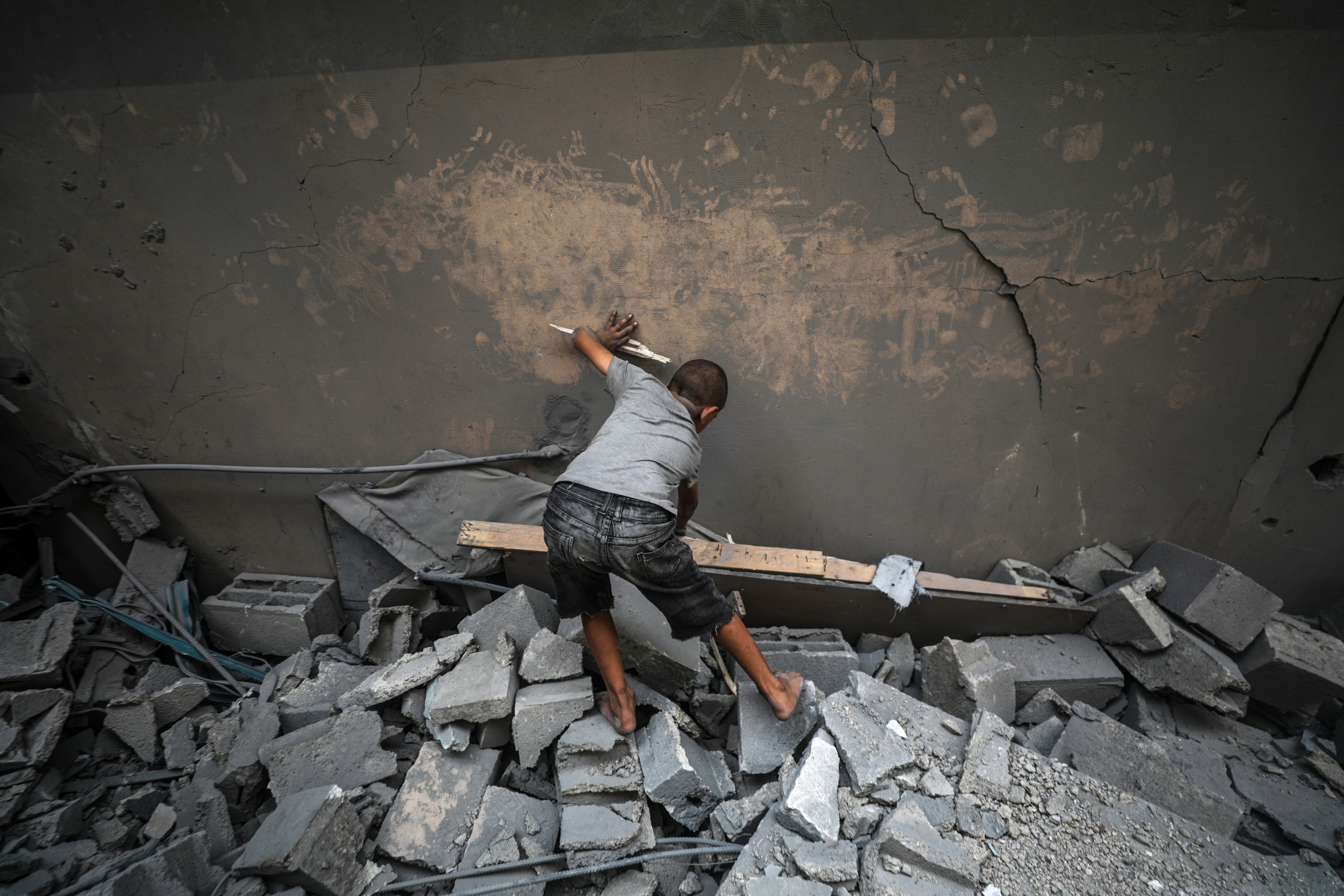 the destroyed Al Aqsa Martyrs Mosque