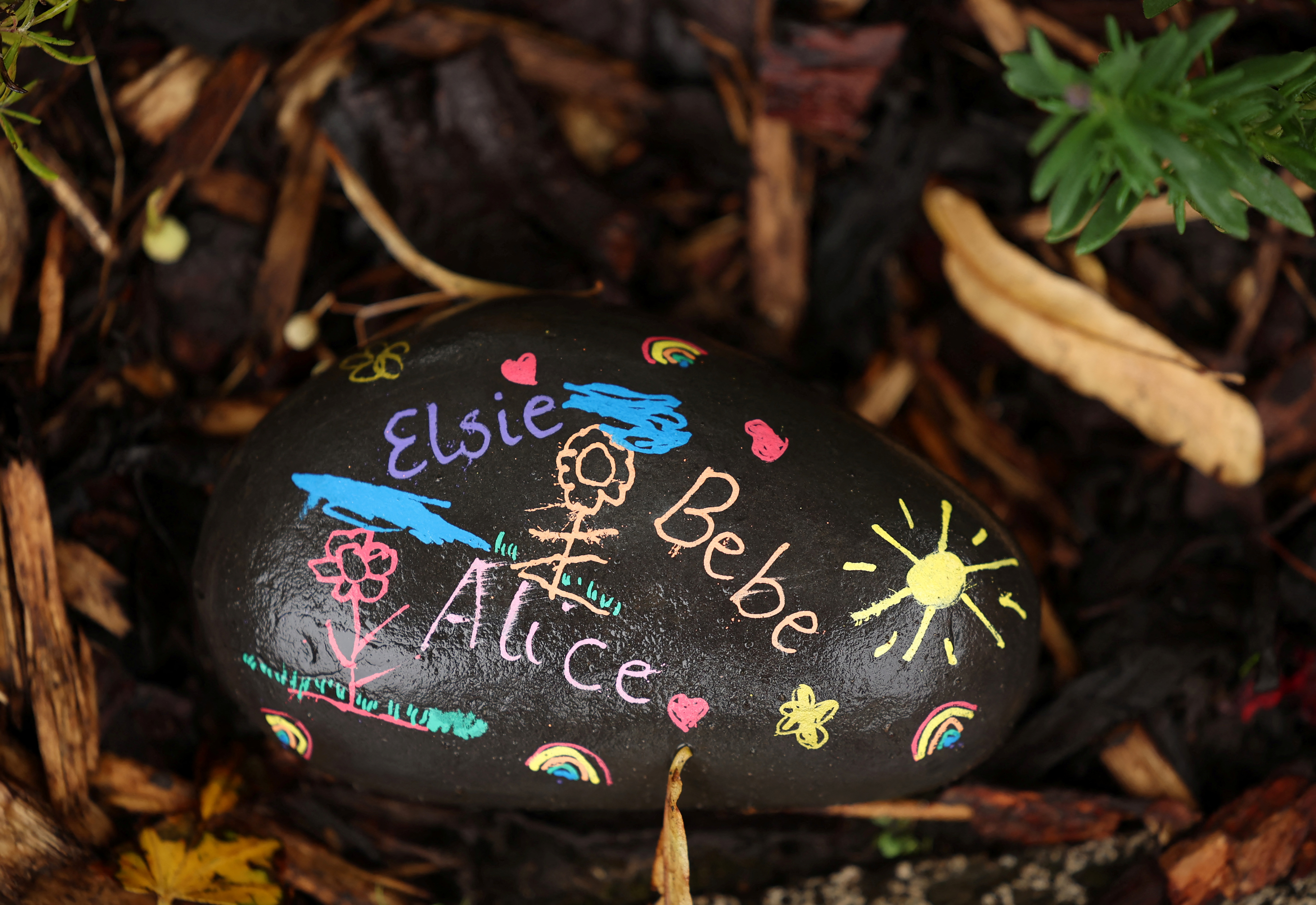 Floral tributes left by members of the public are seen following the fatal knife attack on three young girls in July [File: Phil Noble/Reuters]