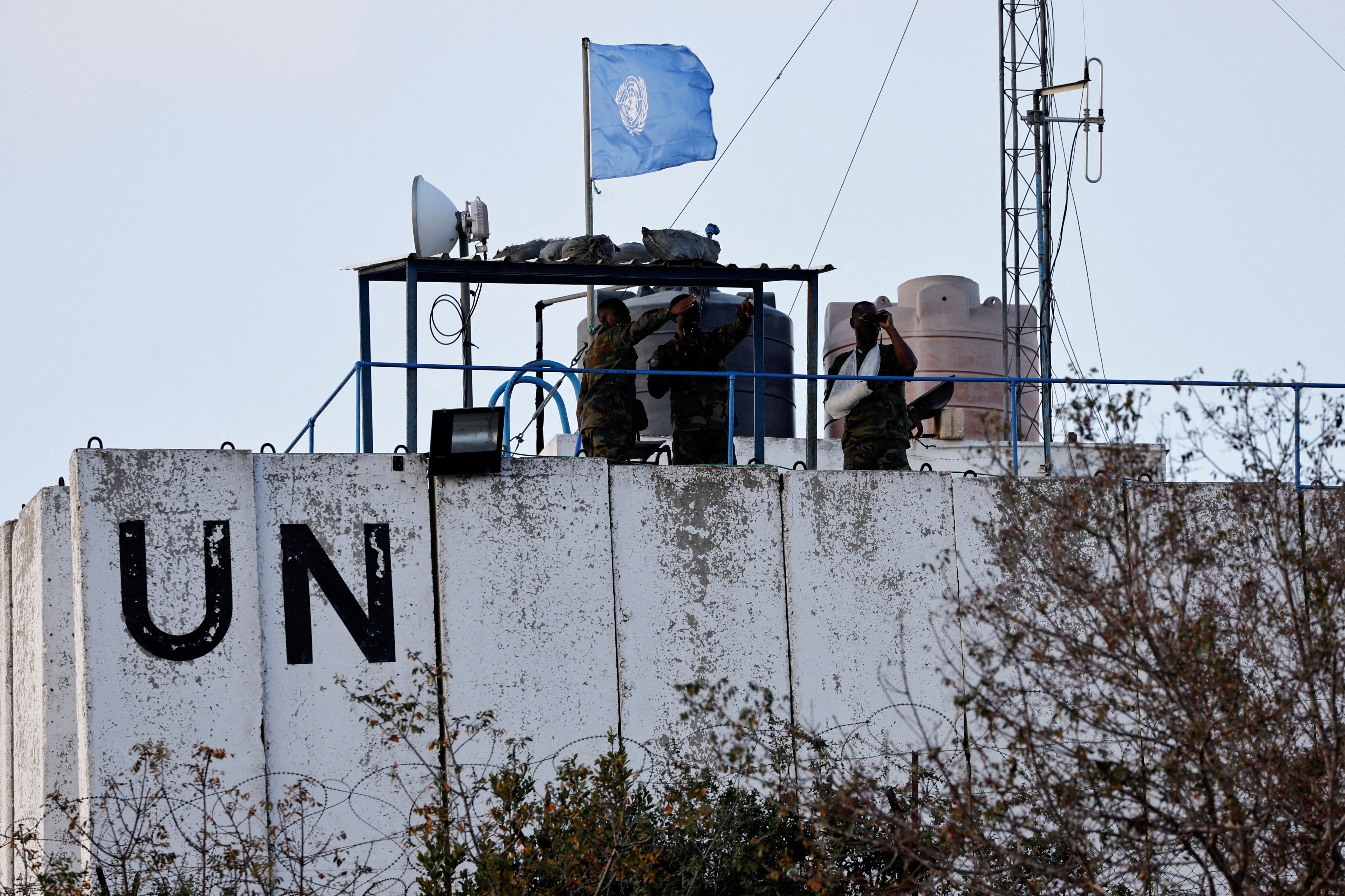 Members of the United Nations peacekeepers (UNIFIL) look at the Lebanese-Israeli border,