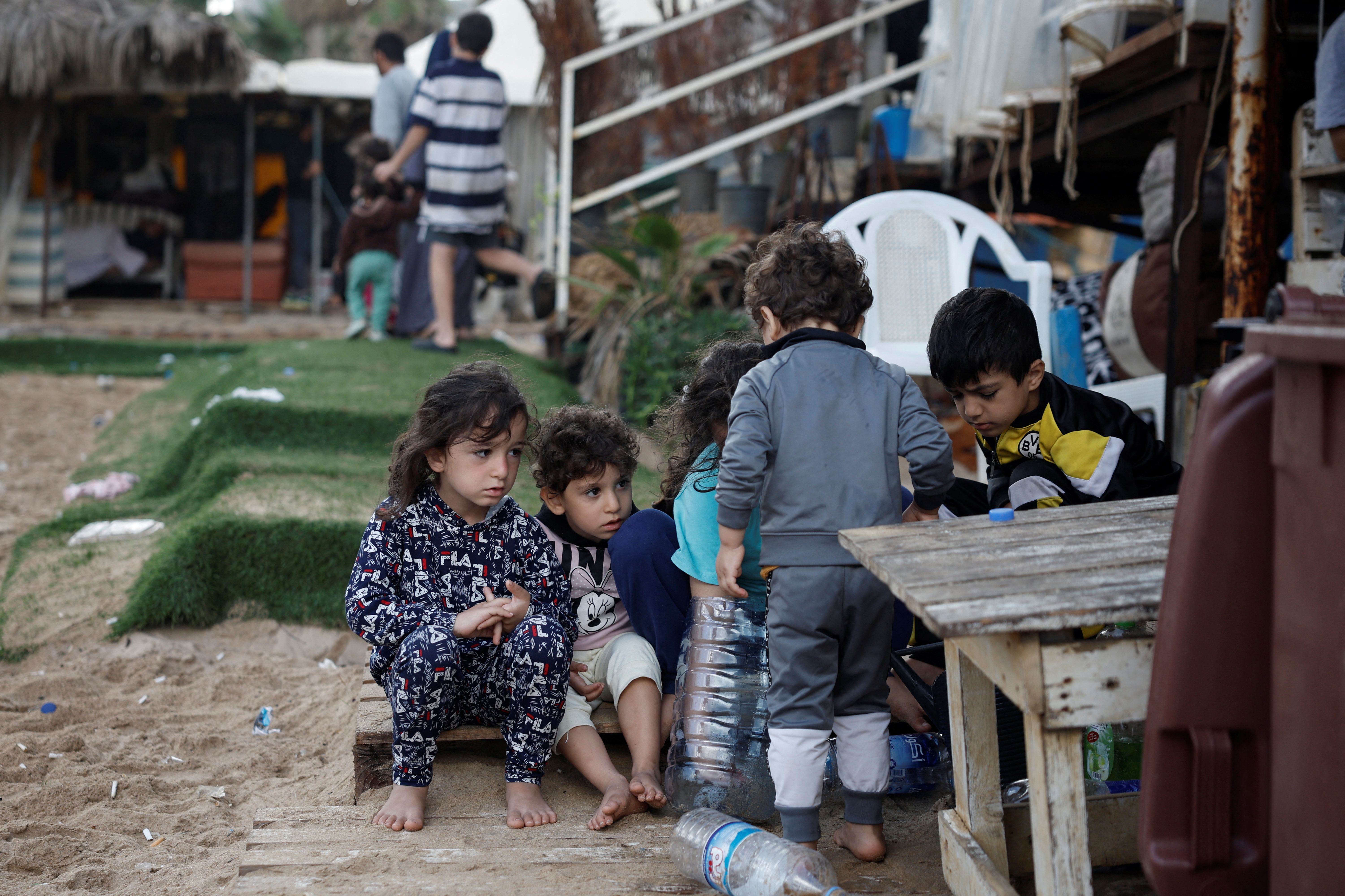 Displaced children play at a makeshift encampment where scores of displaced people live, amid cross-border hostilities between Hezbollah and Israeli forces, at a beach in Beirut, Lebanon, October 1