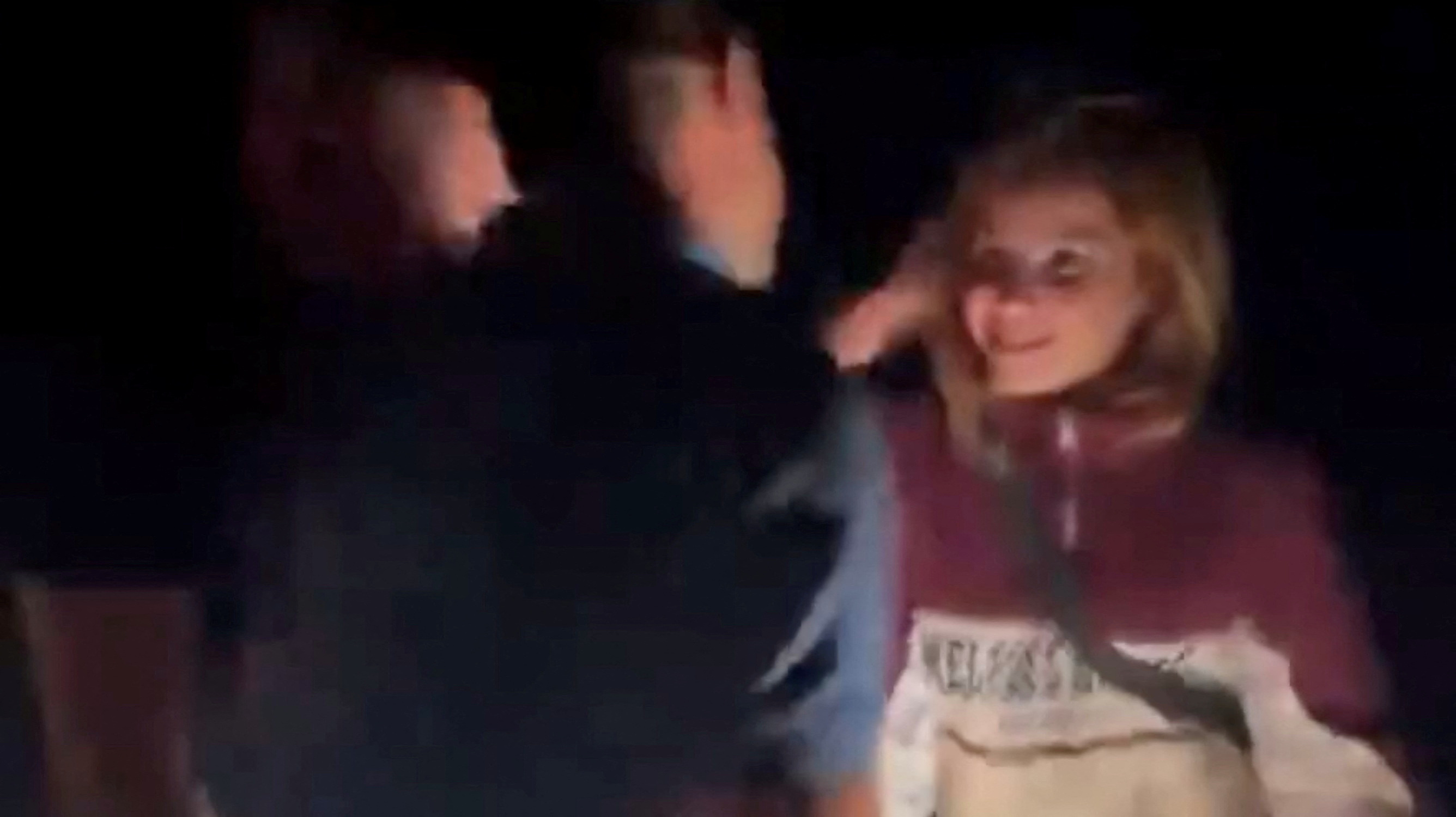 The moment when the Yazidi woman was reunited with her family. She looks delighted