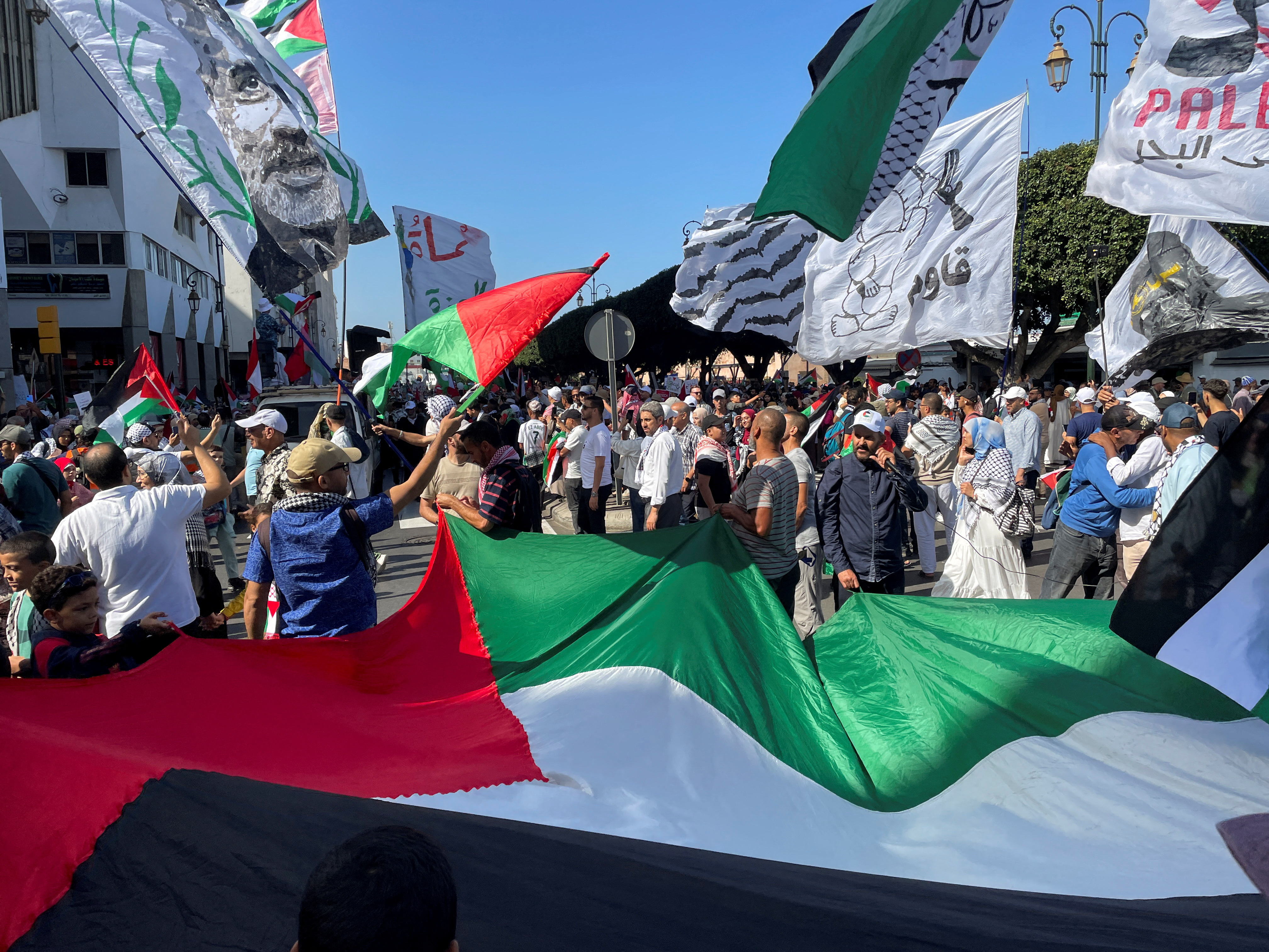 Demonstrators take part in a protest in support of Palestinians and Lebanese, amid the ongoing conflict between Israel and Hamas in Gaza and the hostilities between Hezbollah and Israeli forces, in downtown Rabat, Morocco