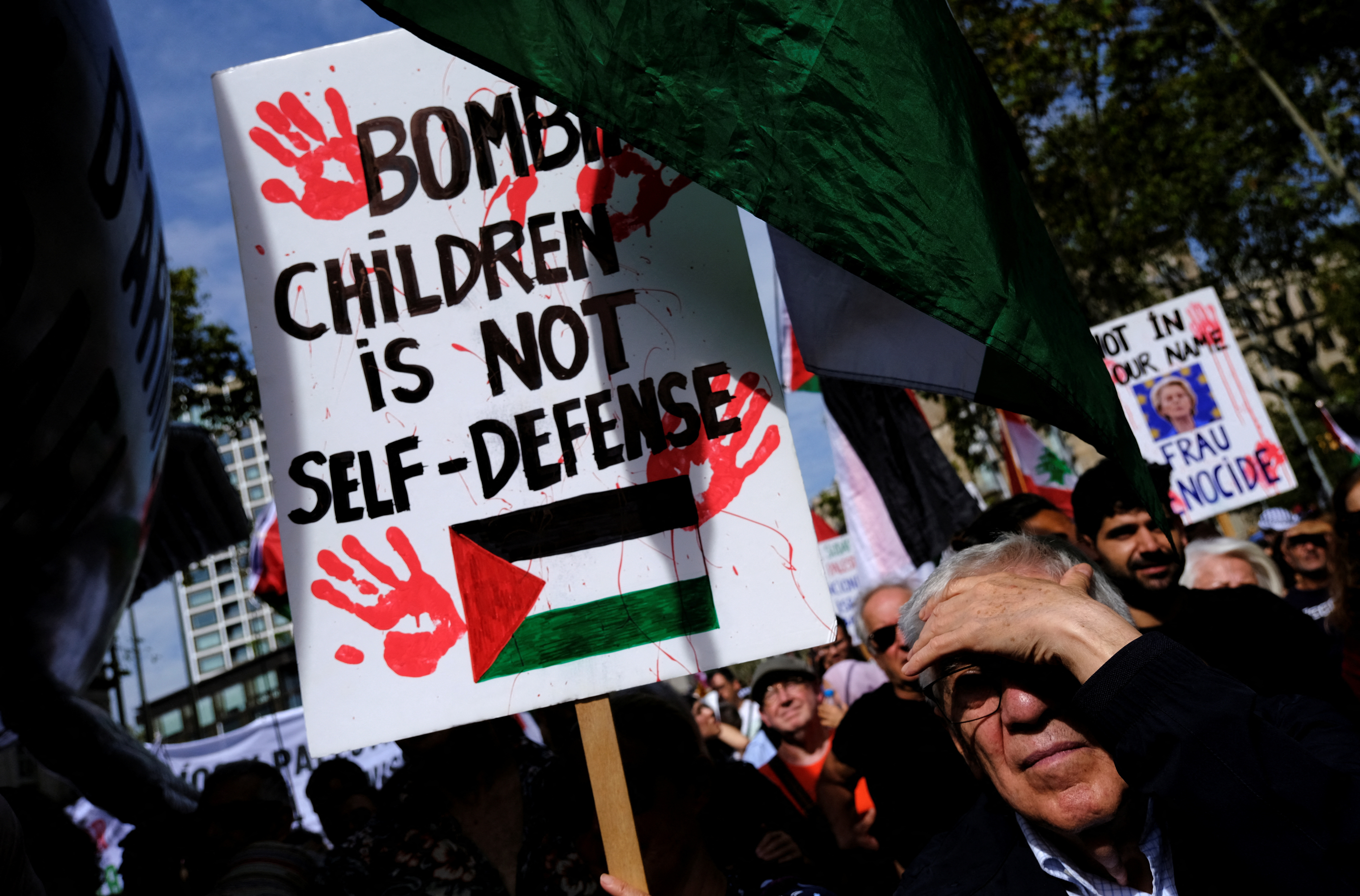 People demonstrate during a protest to express support for Palestinians in Gaza, a day ahead of the anniversary of the October 7th attack, amid the Israel-Hamas conflict, in Barcelona, Spain October 6