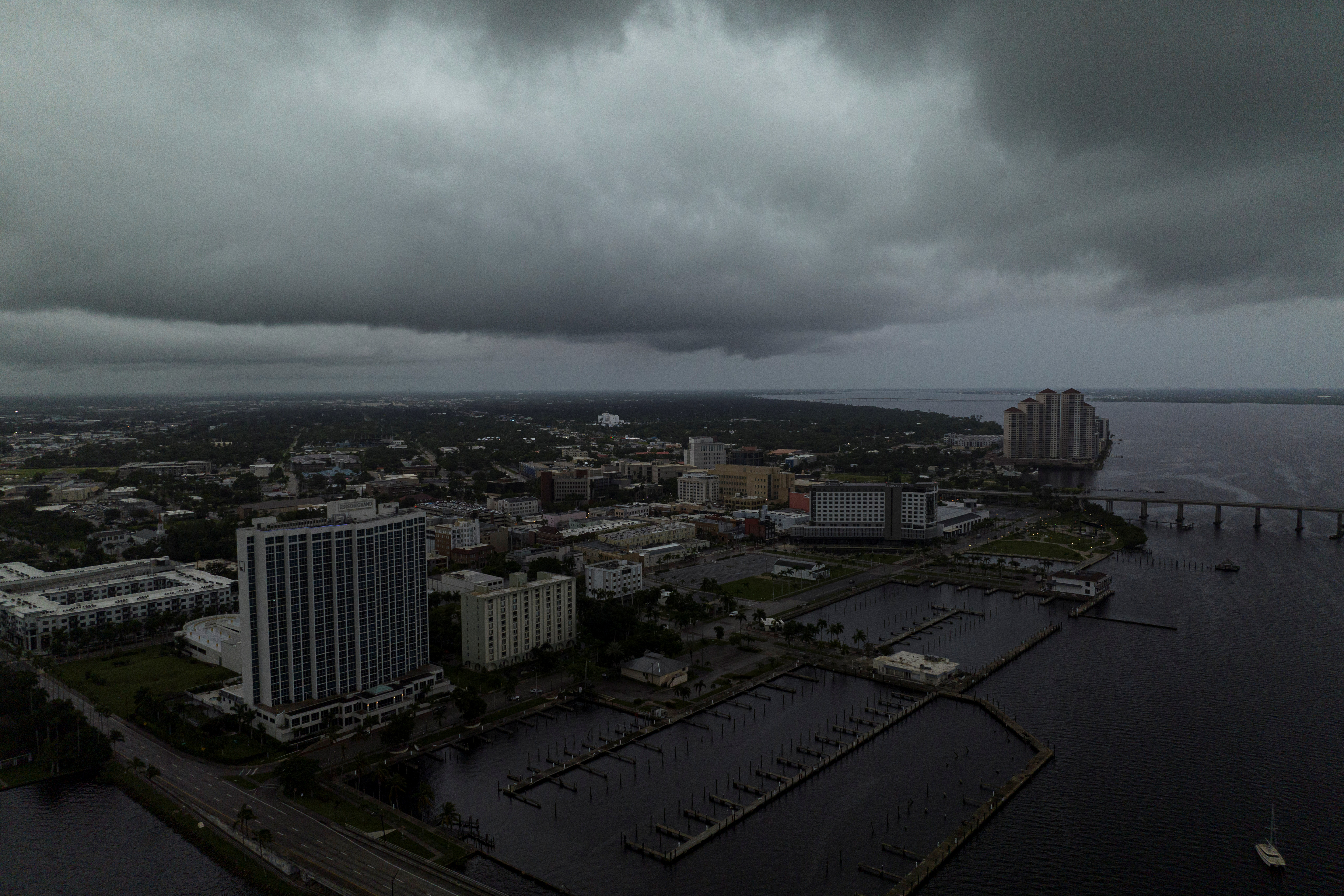 A drone view shows storm clouds over the Caloosahatchee River