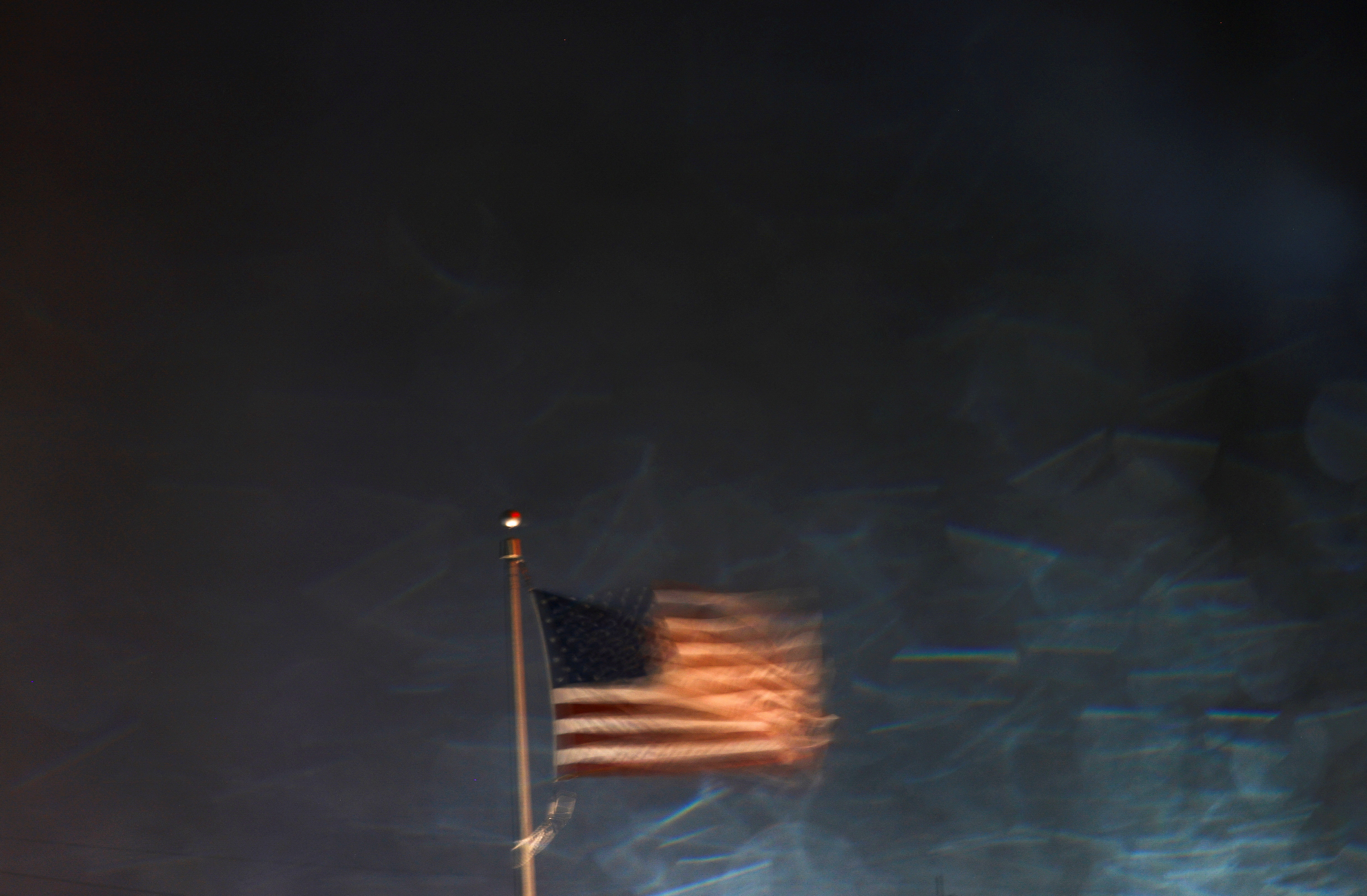 An American flag waves as Hurricane Milton approaches, in Orlando, Florida, U.S., October 9, 2024. REUTERS/Jose Luis Gonzalez