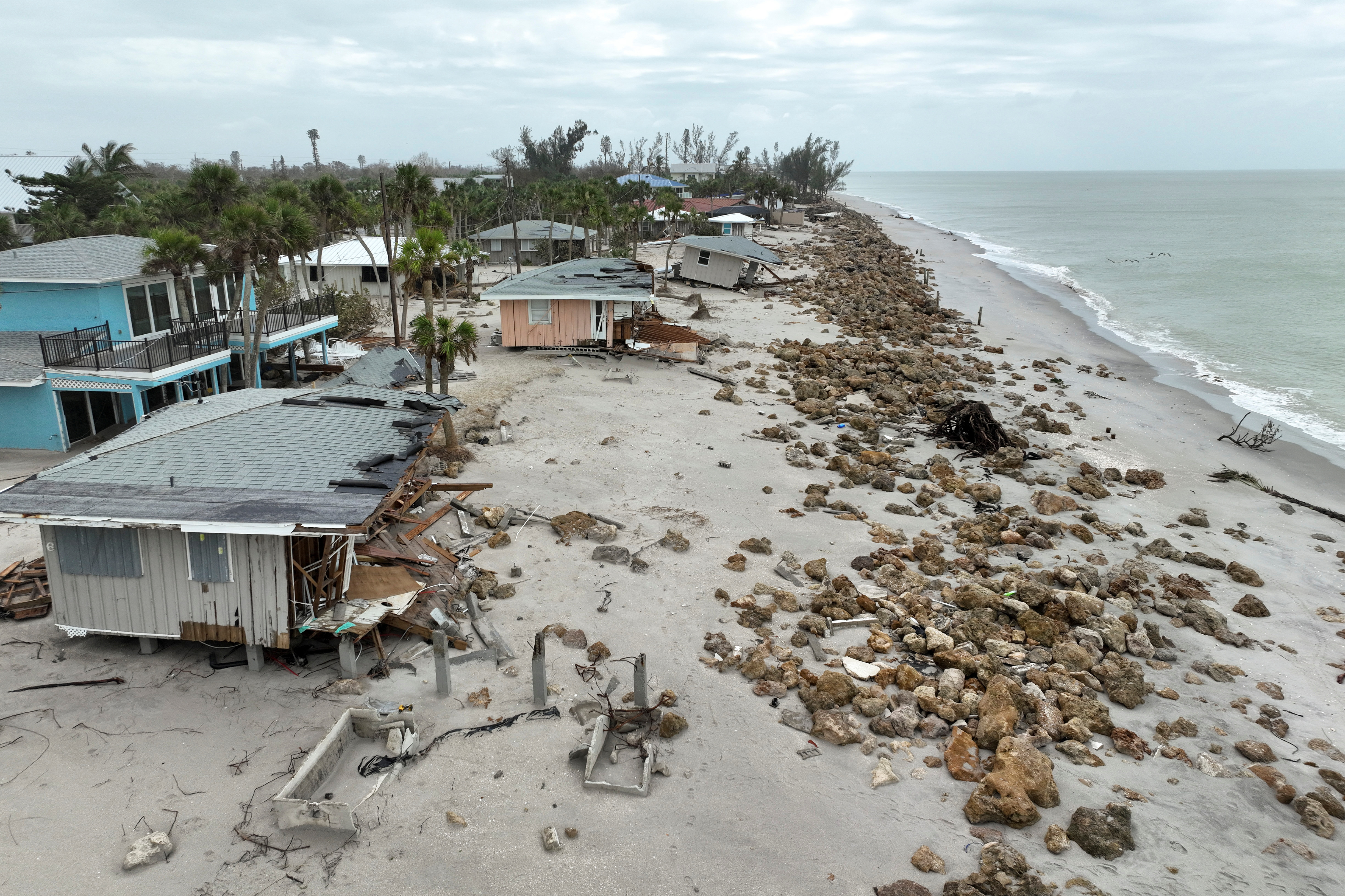 A drone view shows destroyed beach houses