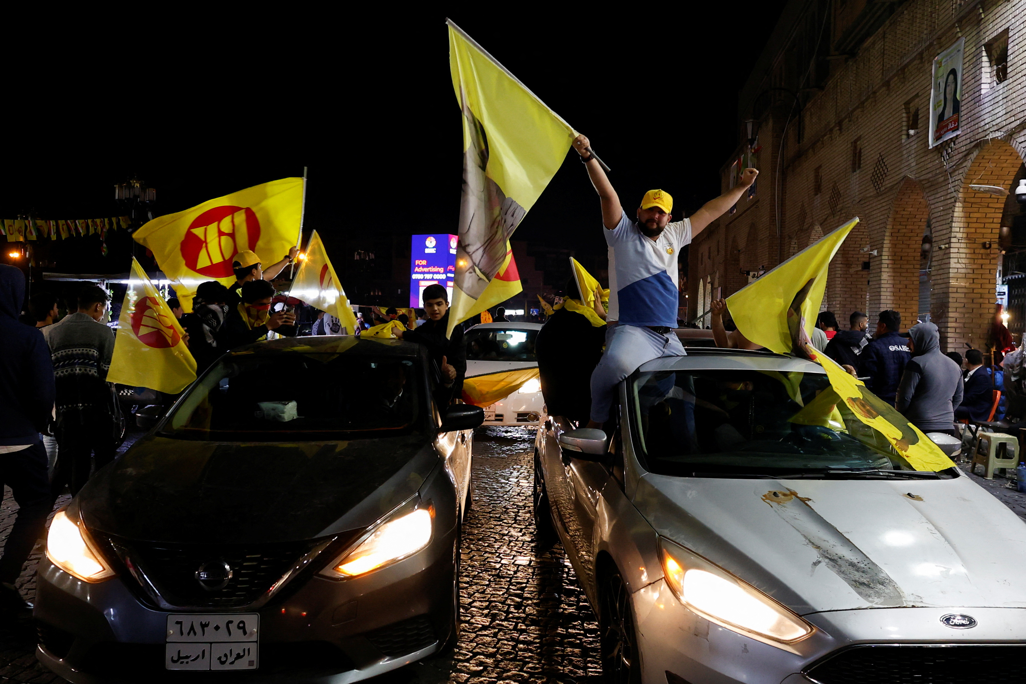 Supporters of the Kurdistan Democratic Party celebrate after voting is closed for the Iraq's Kurdistan region parliamentary election