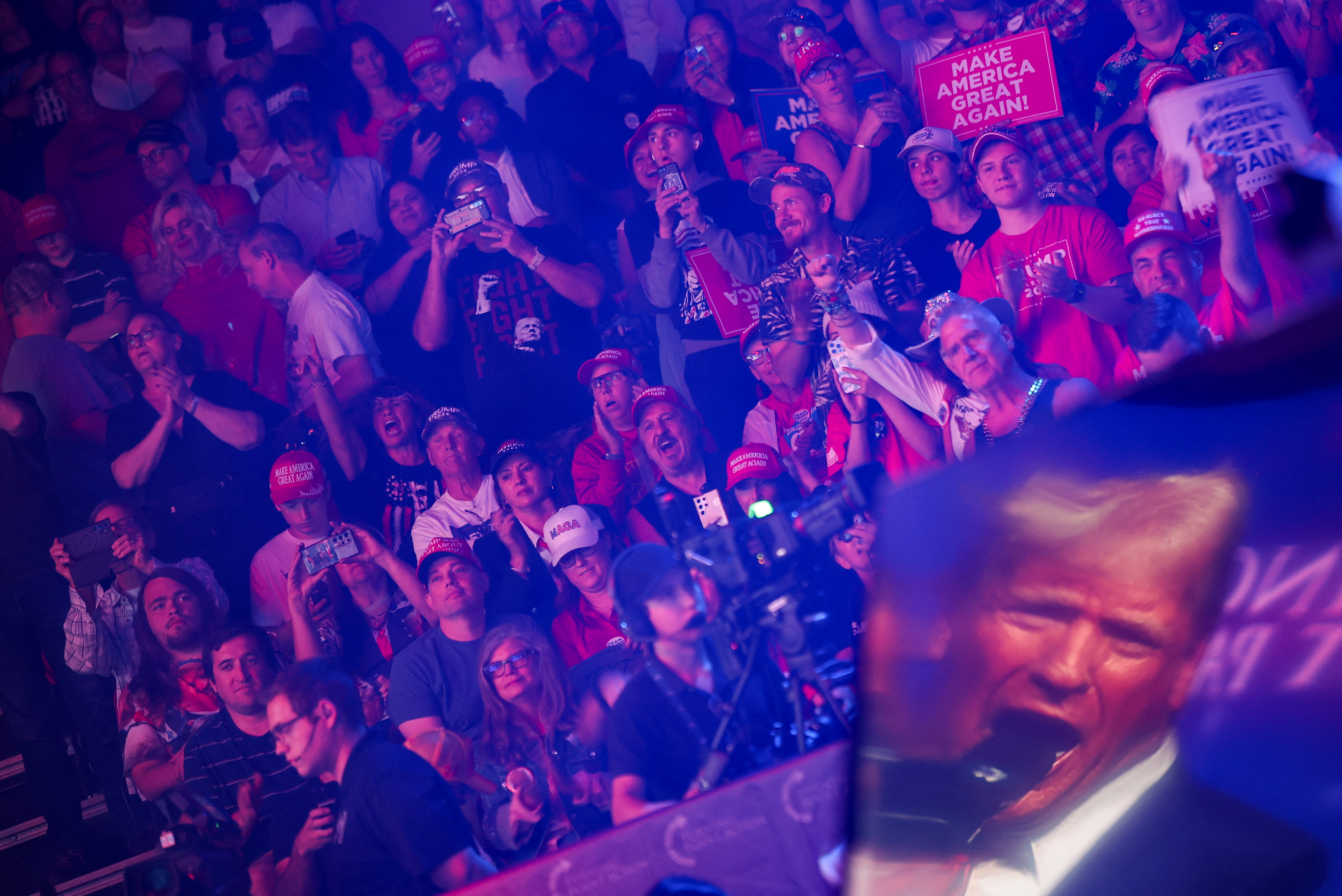 Supporters react as Republican presidential nominee and former U.S. President Donald Trump