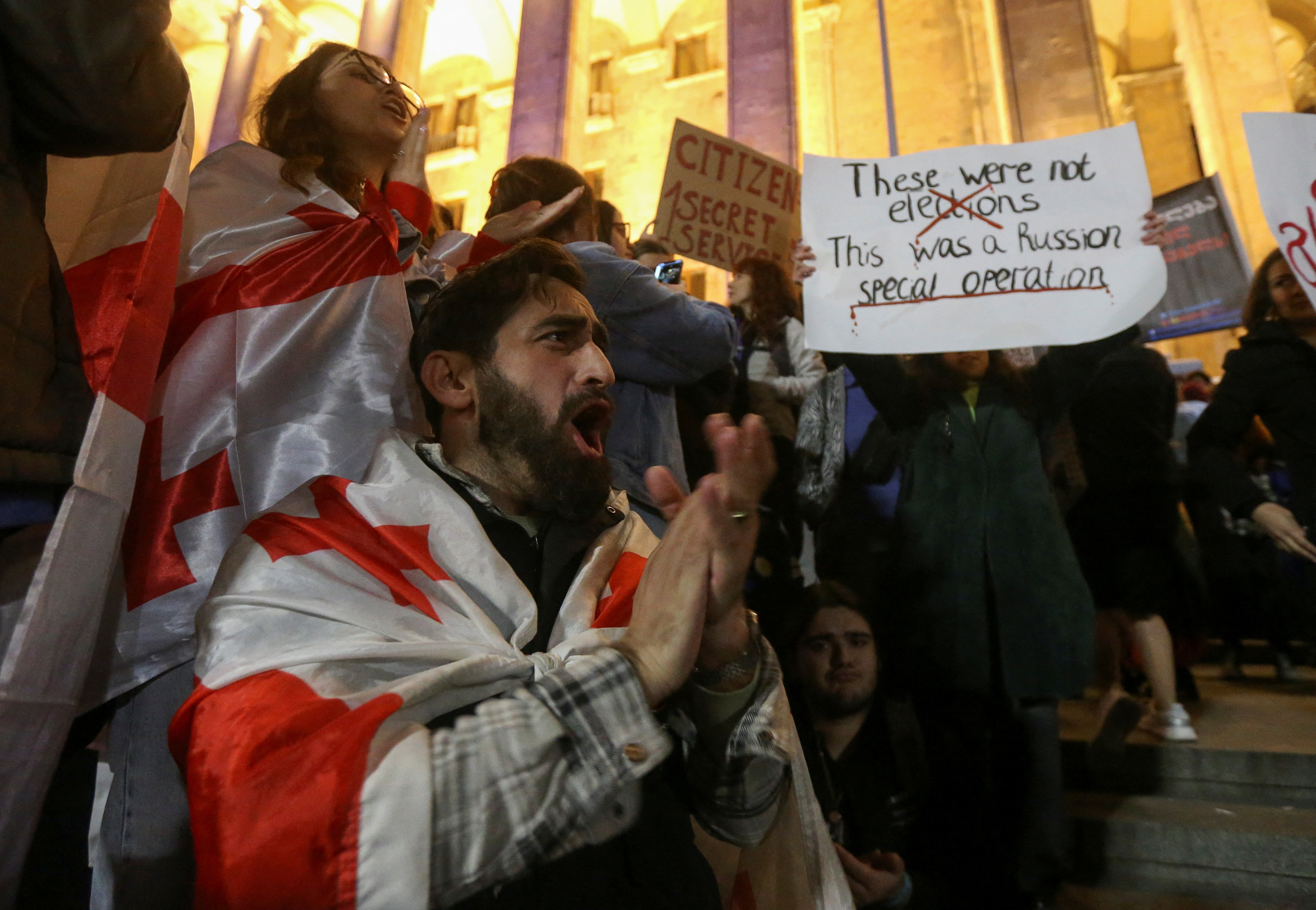 Supporters of Georgia's opposition parties hold a rally to protest and dispute the result of a recent parliamentary election won by the ruling Georgian Dream party, in Tbilisi, Georgia