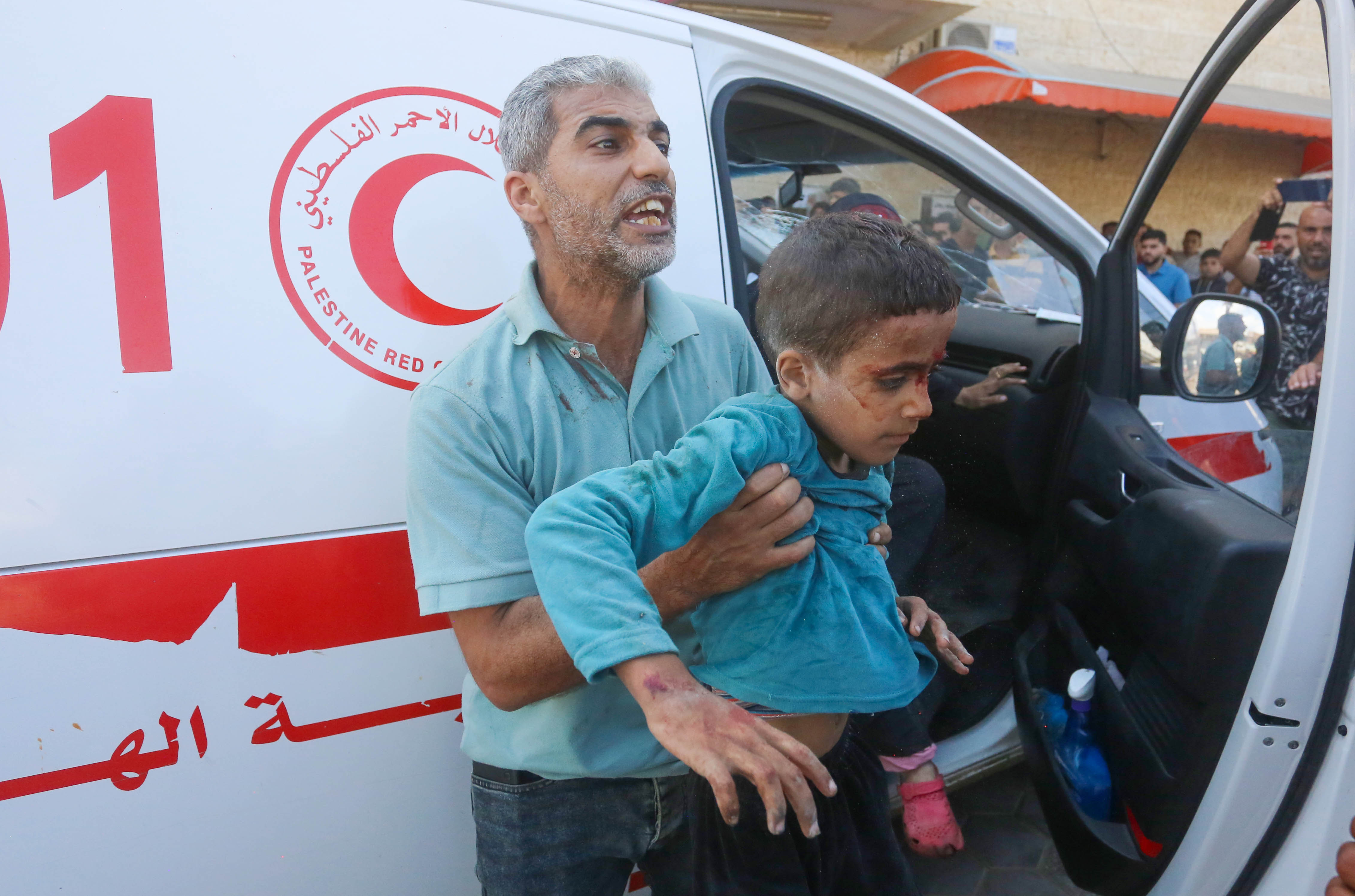 Wounded Palestinians, including children, are brought to Al-Aqsa Martyrs Hospital in Deir el-Balah.