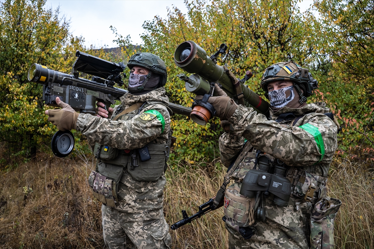 Two Ukrainian soldiers check the scopes of their anti-aircraft systems to ensure they’re working properly before heading out on a mission in Donetsk Oblast, Ukraine on October 19, 2024. The Ukrainian military relies on small, mobile units to defend and protect the skies as warfare evolves, with the proliferation of drones and Russian air superiority. Photojournalist:Fermin Torrano