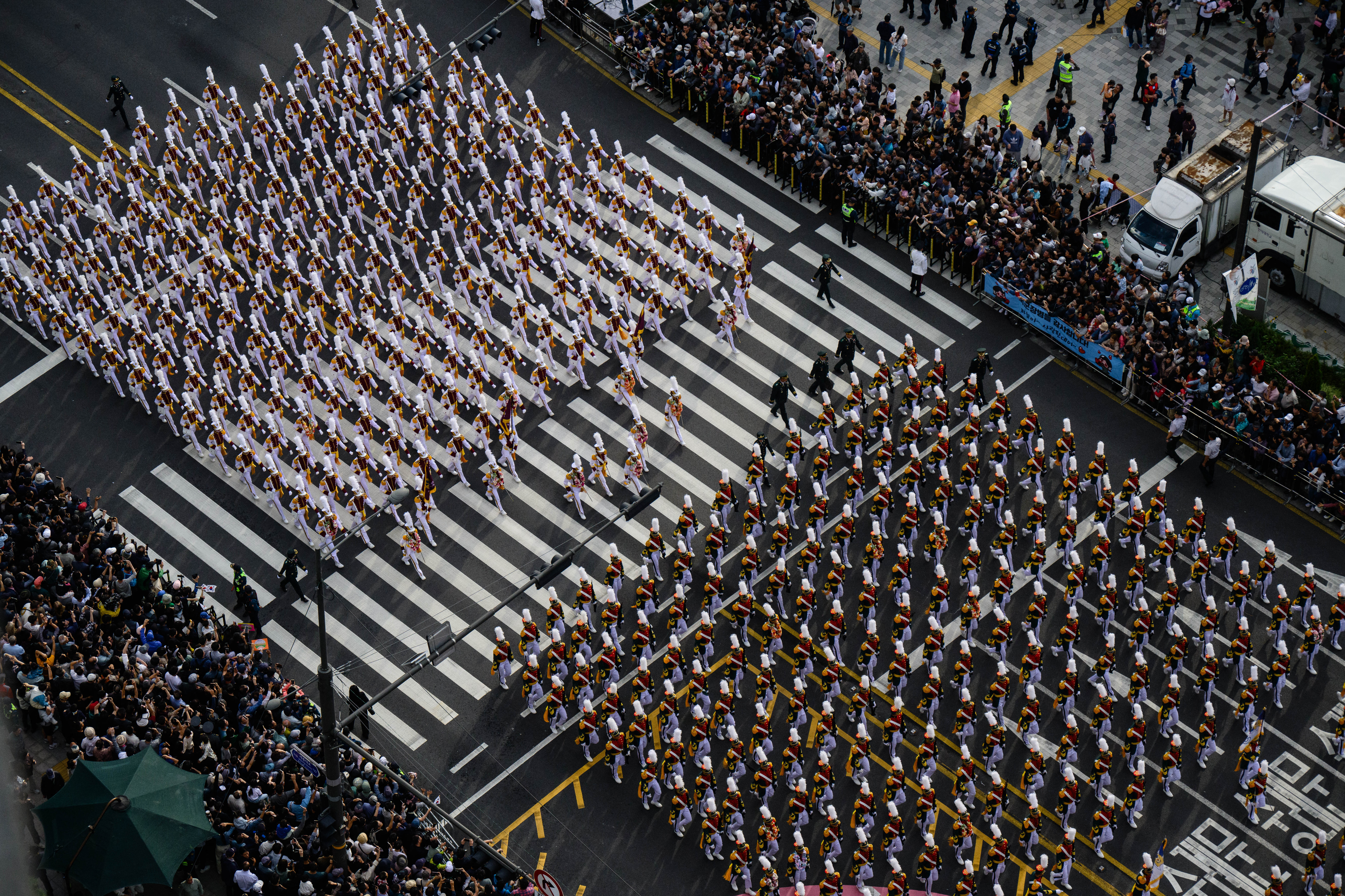 A view of the parade from above as Korea Military Academy personnel march on the streets of Seoul