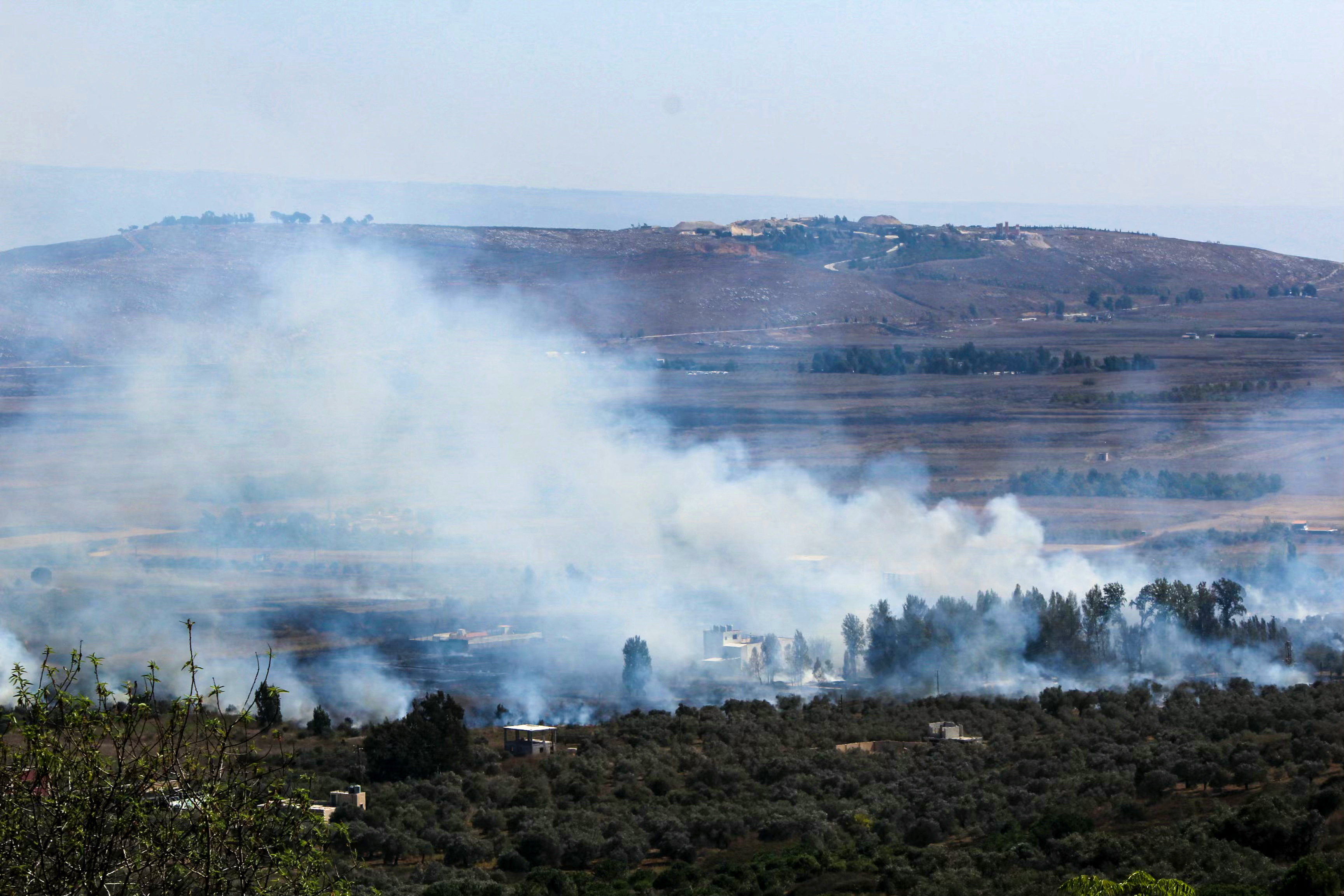 Smoke rises from an area targeted by Israeli shelling in the Marjeyoun plain along Lebanon's southern border on October 4, 2024. - The Israeli army on October 4 said its forces had hit more than 2,000 sites during its four-day incursion into southern Lebanon targeting Hezbollah positions. (Photo by AFP)