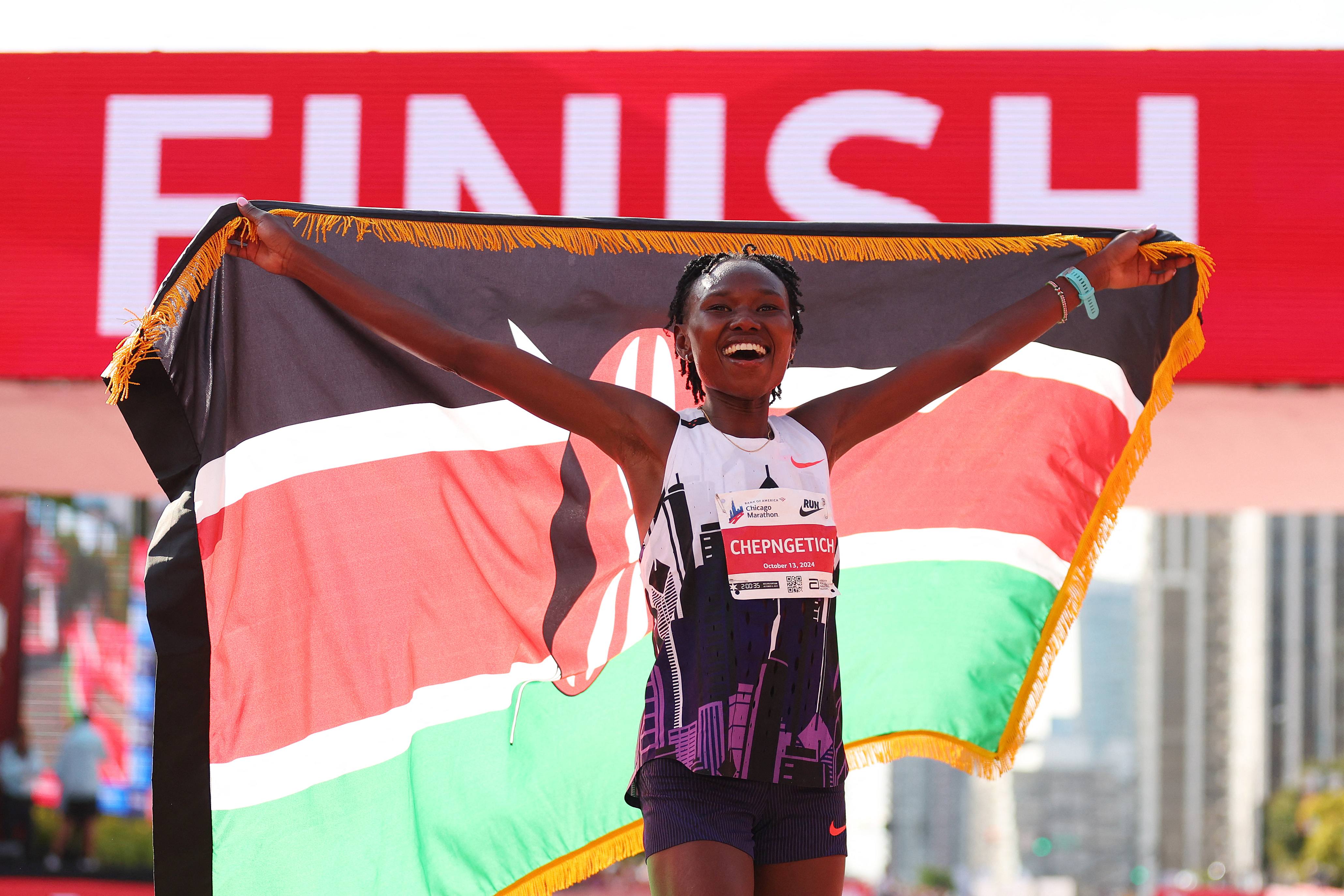 Ruth Chepngetich of Kenya celebrates after crossing the finish line to win the 2024 Chicago Marathon