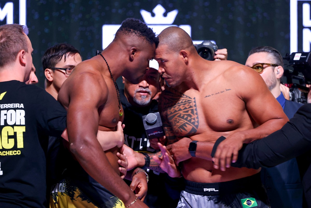 Cameroon's Francis Ngannou (L) and Brazil's Renan Ferreira stare each other down during a weigh-in in Riyadh