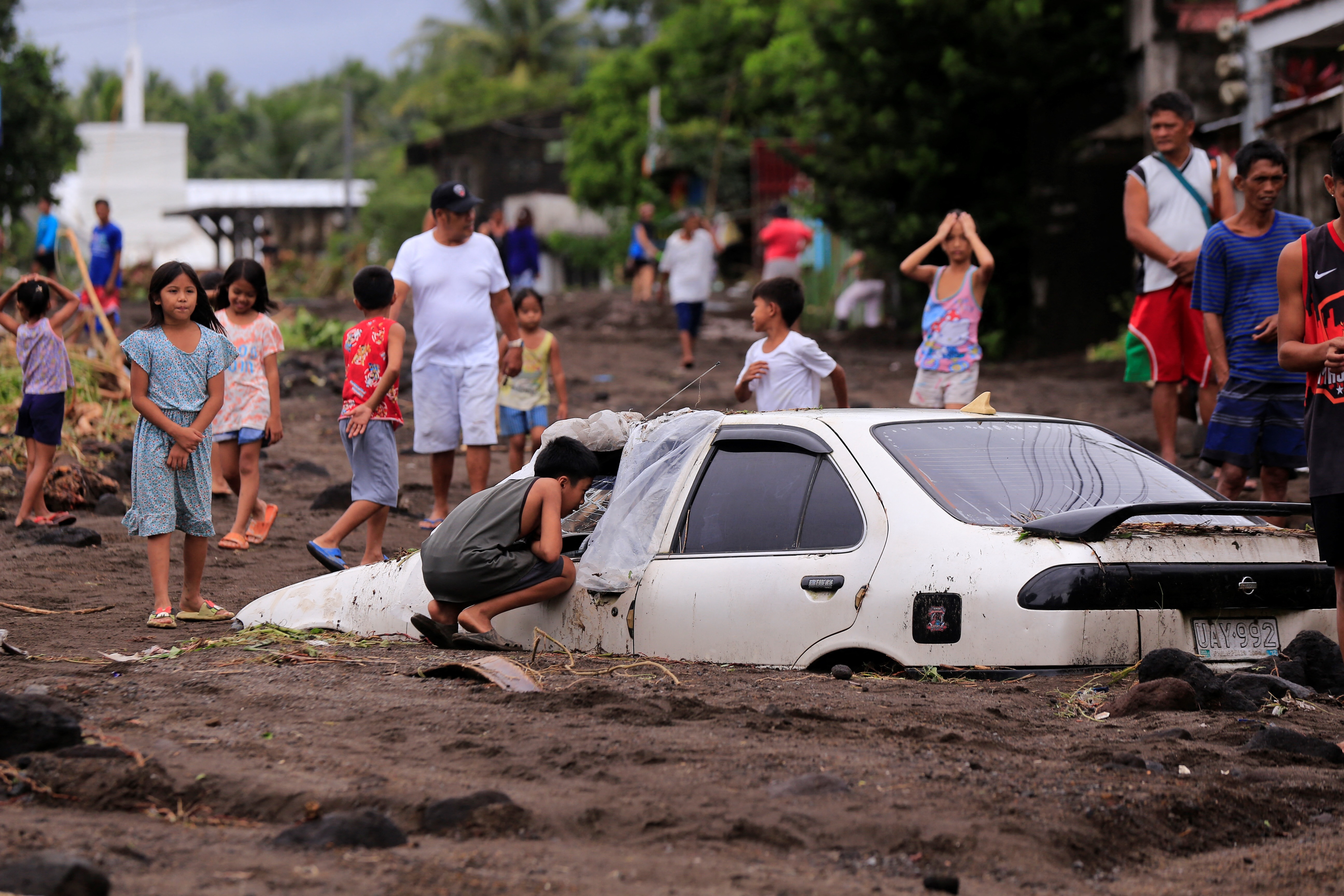 thousands evacuated as tropical storm batters Philippines