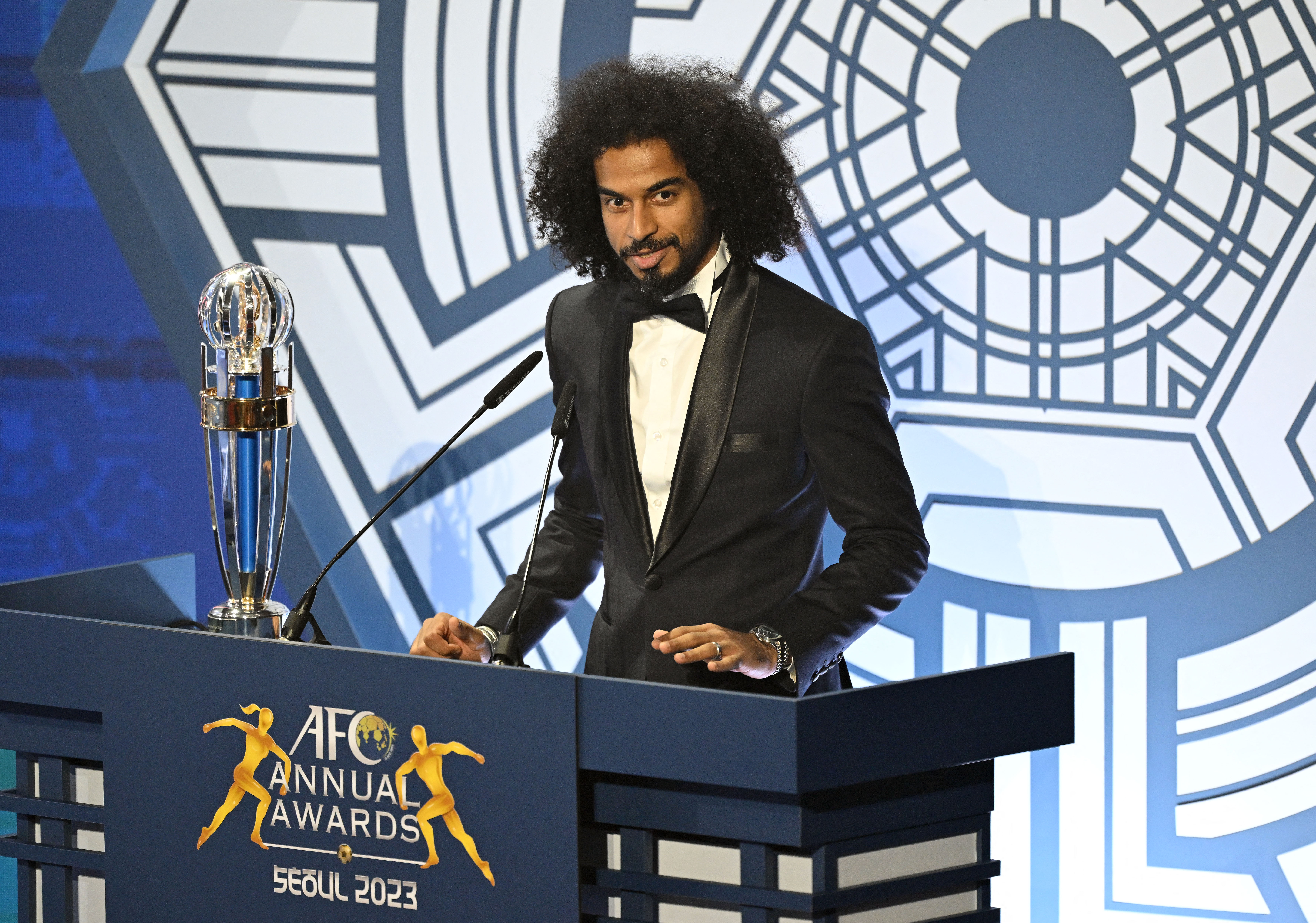 Qatar's forward Akram Afif speaks after receiving the AFC Player of the Year award during the AFC Annual Awards 2023 ceremony in Seoul on October 29, 2024 [Jung Yeon-je/AFP]