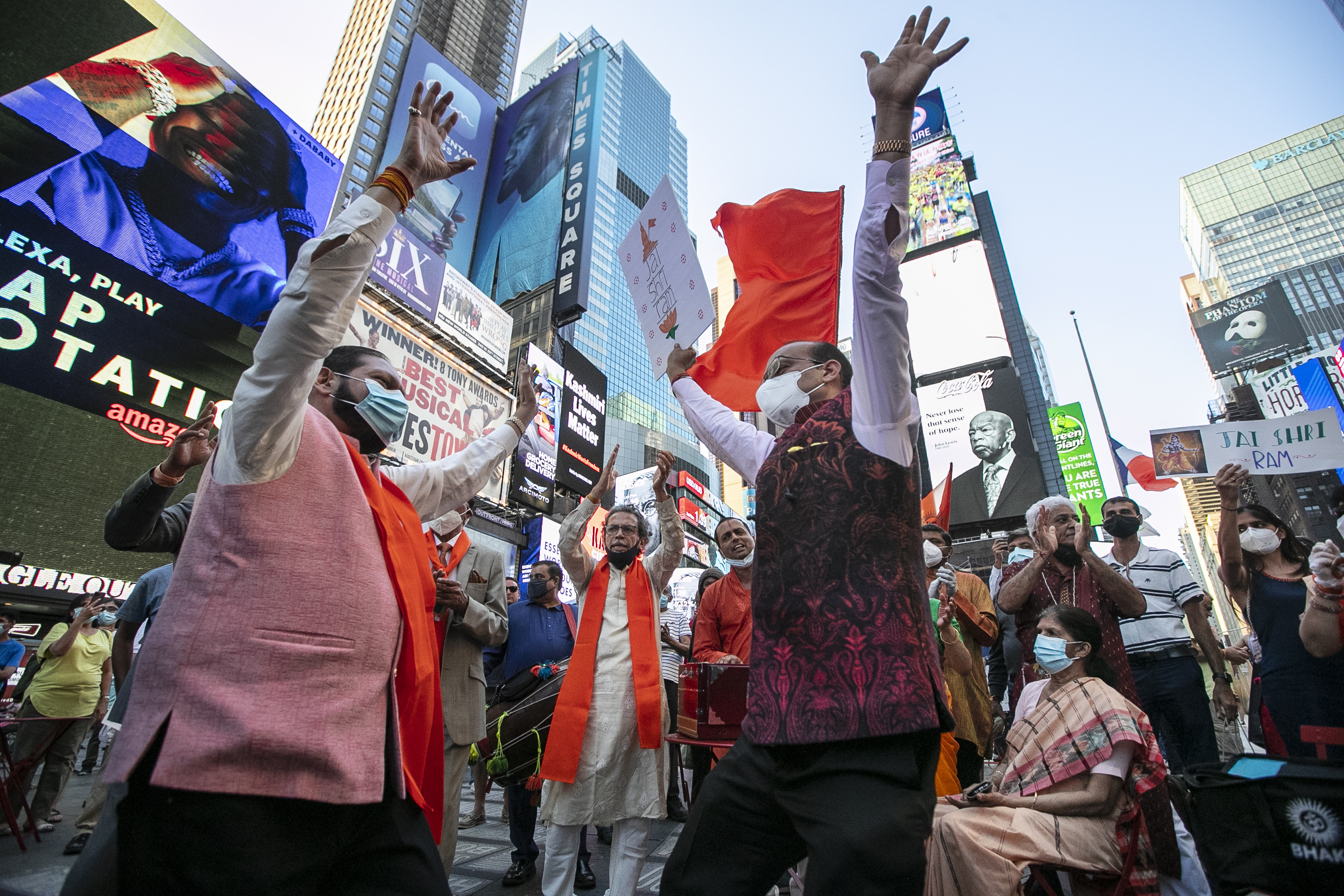 People gather in Times Square after the groundbreaking ceremony of a temple dedicated to the Hindu god Ram by Indian Prime Minister Narendra Modi