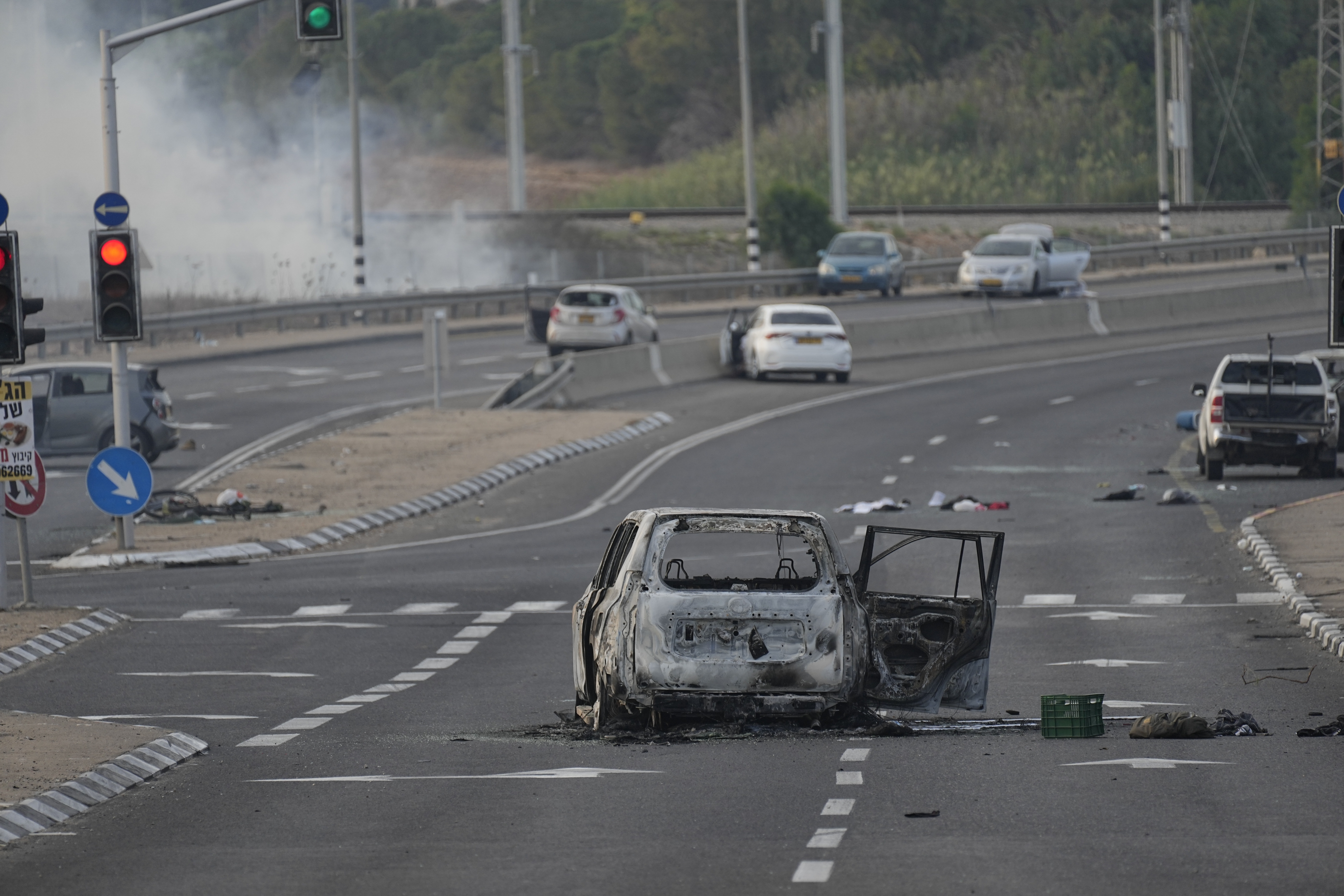 A car destroyed in an attack by Palestinian militants is seen in Sderot