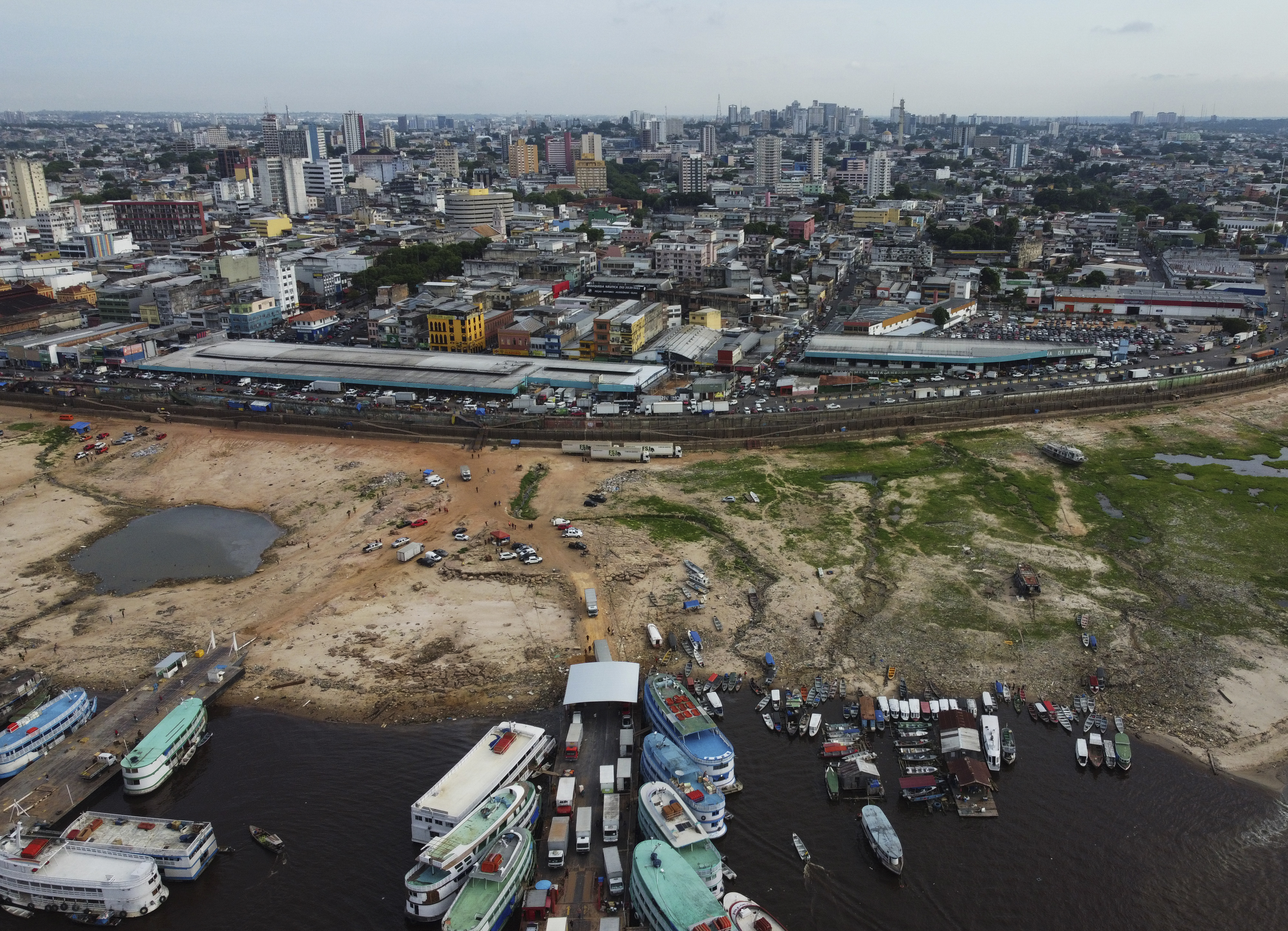 An aerial view of the Port of Manaus, with riverbanks extended and dried by drought.
