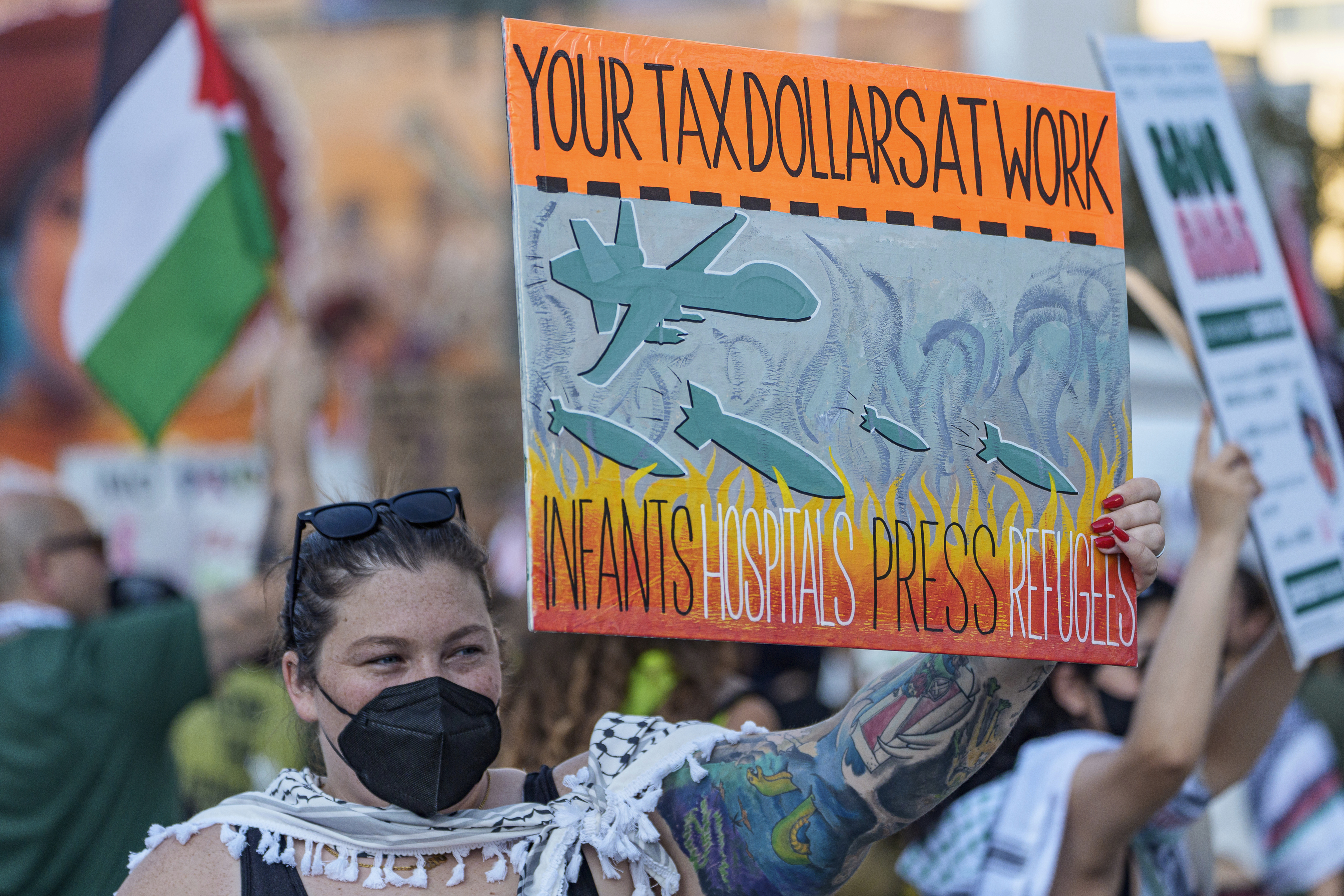 Palestinian supporters march through downtown Los Angeles on Saturday, Oct. 5