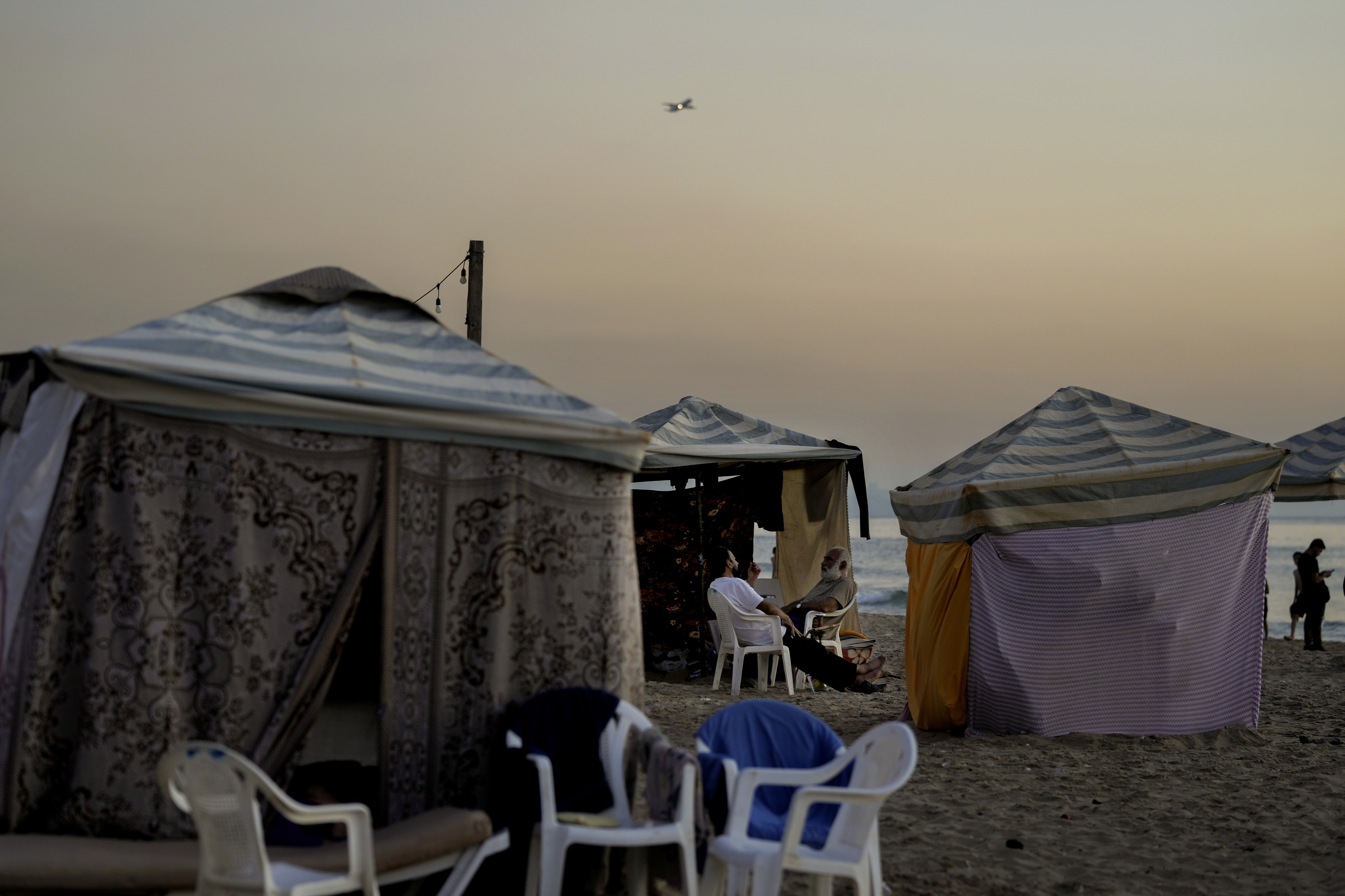 Tents set up as temporary shelters by displaced families fleeing the Israeli airstrikes in the south and Dahiyeh, are seen along the Ramlet al-Baida public beach in Beirut, Lebanon, Tuesday Oct. 8