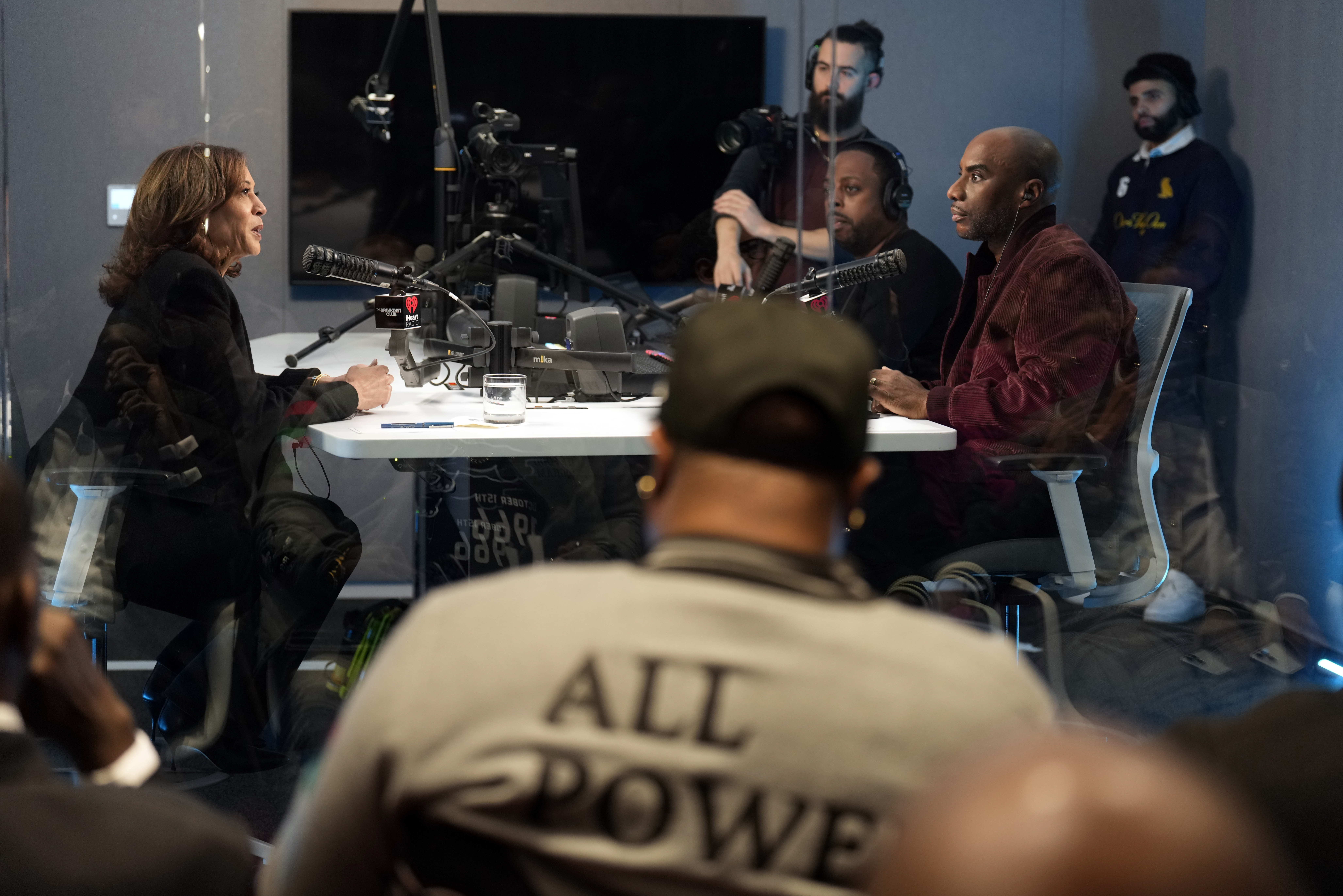 Charlamagne tha God interviews Kamala Harris in a radio studio