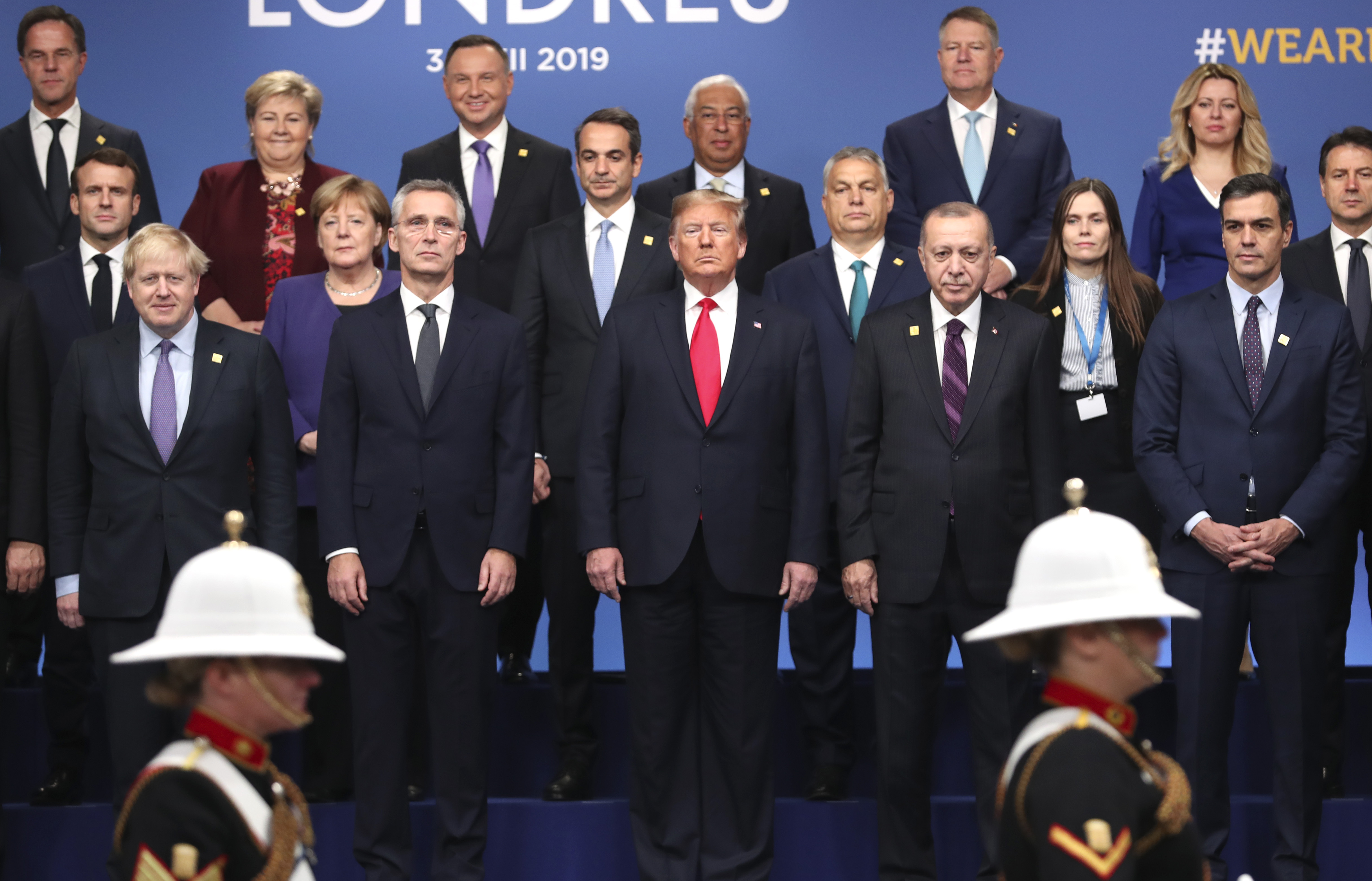 From front row left, British Prime Minister Boris Johnson, NATO Secretary-General Jens Stoltenberg, US President Donald Trump, Turkish President Recep Tayyip Erdogan and Spanish Prime Minister Pedro Sanchez attend a ceremony event