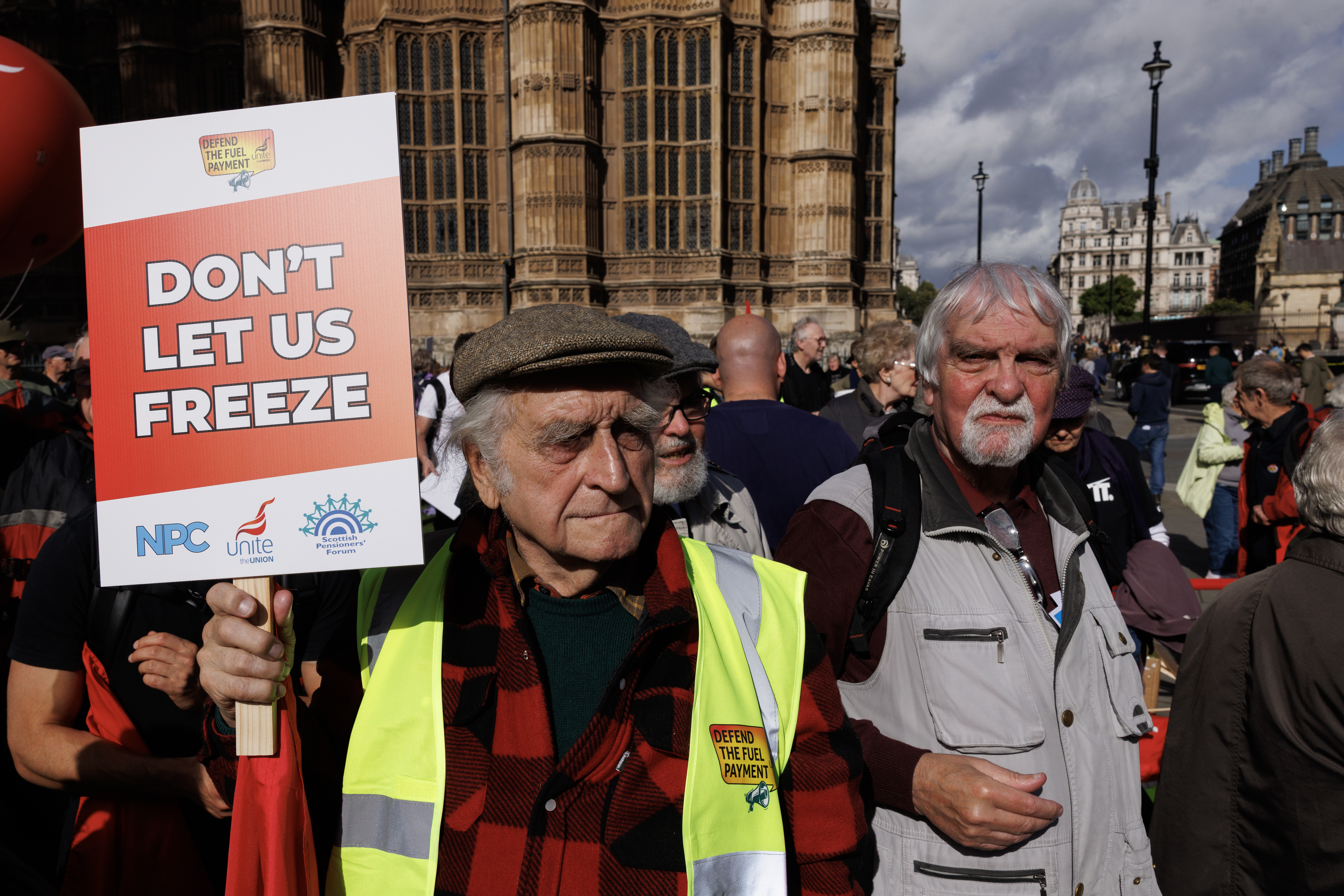 Pensioners raising banners in protest