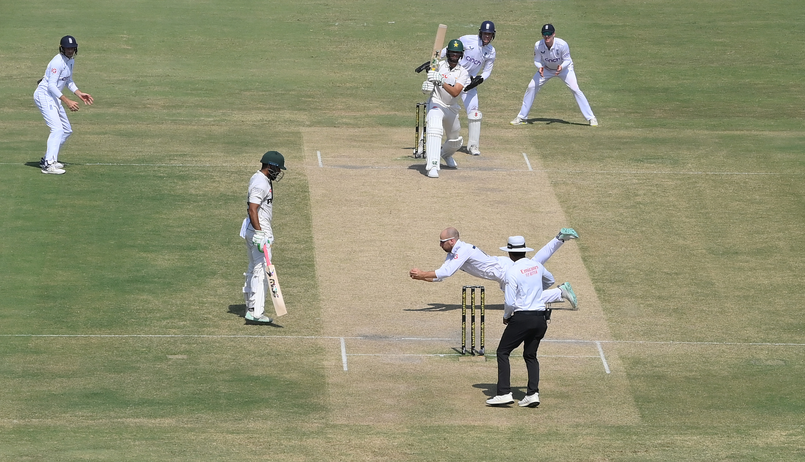 MULTAN, PAKISTAN - OCTOBER 11: England bowler Jack Leach dives to catch out Pakistan batsman Shaheen Shah Afridi off his own bowling during day five of the First Test Match between Pakistan and England at Multan Cricket Stadium on October 11, 2024 in Multan, Pakistan. (Photo by Stu Forster/Getty Images)