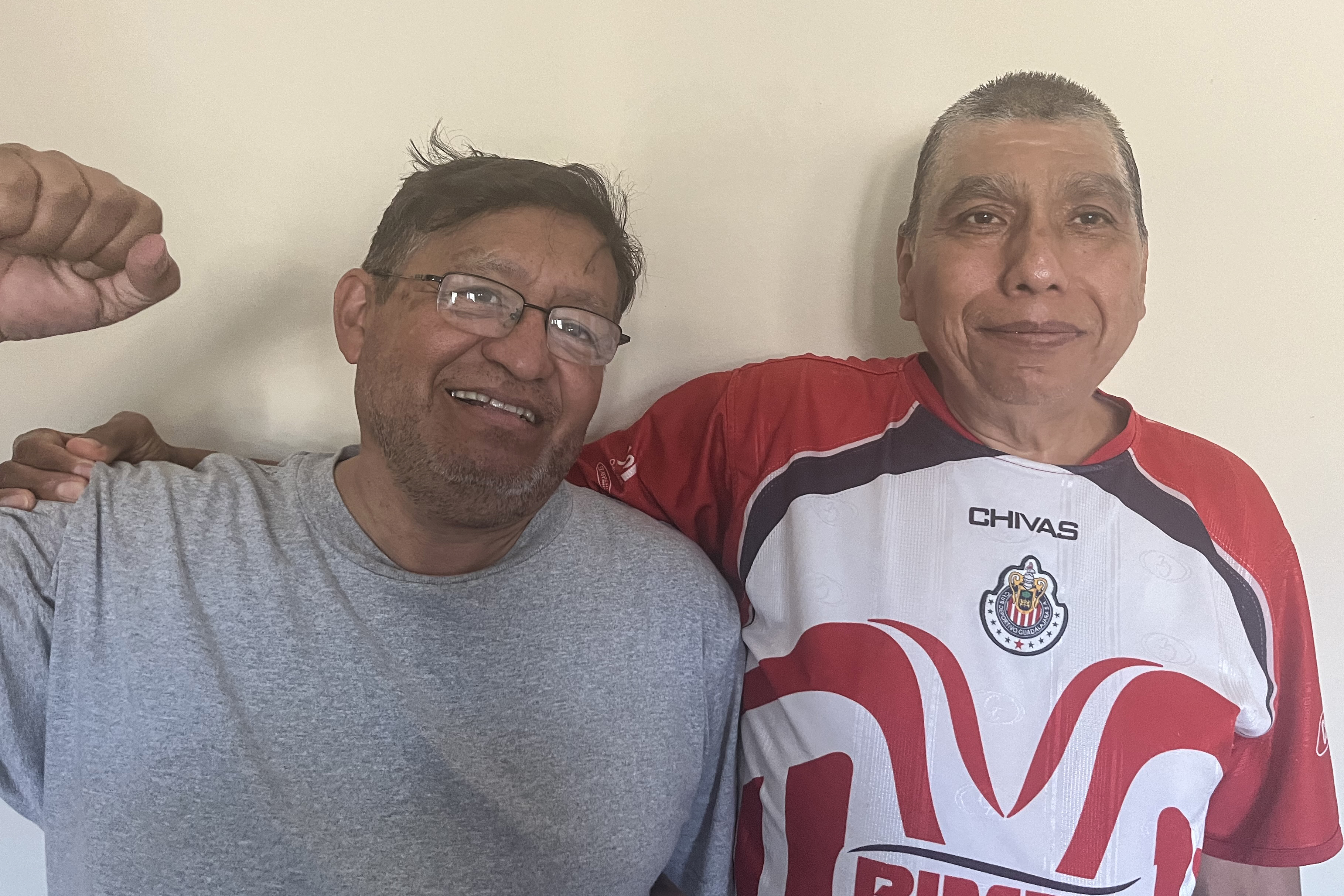 Marco Cajas (left) and his neighbor have sued their landlord after a fire caused a nearly two month long power outage in their apartment building